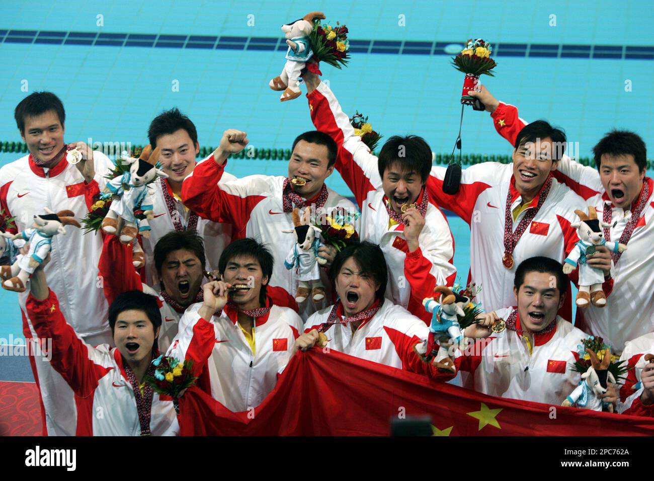 China's water polo team members celebrate their gold medal victory