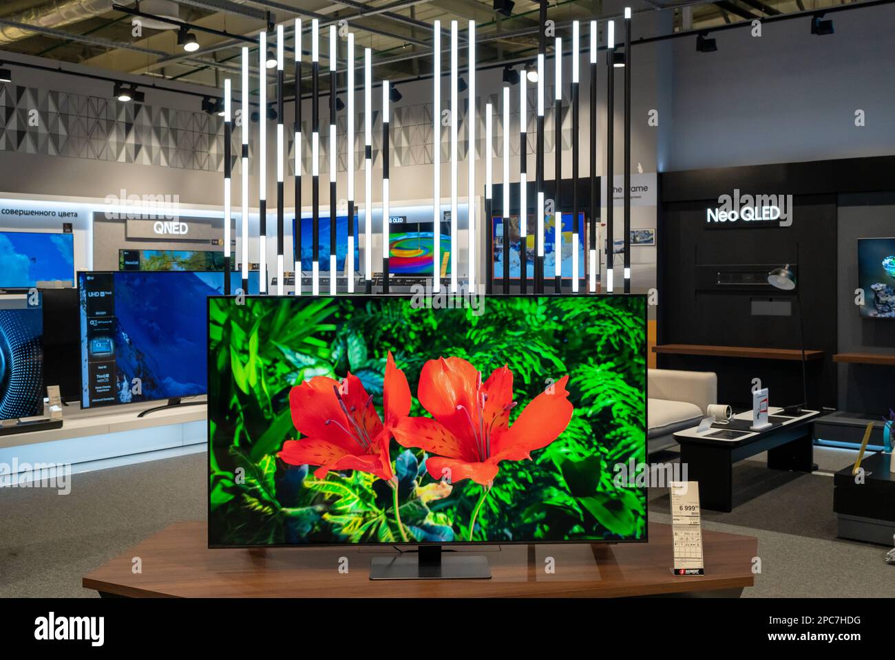 Exposition of 8K TVs of different brands in an electronics store. Minsk