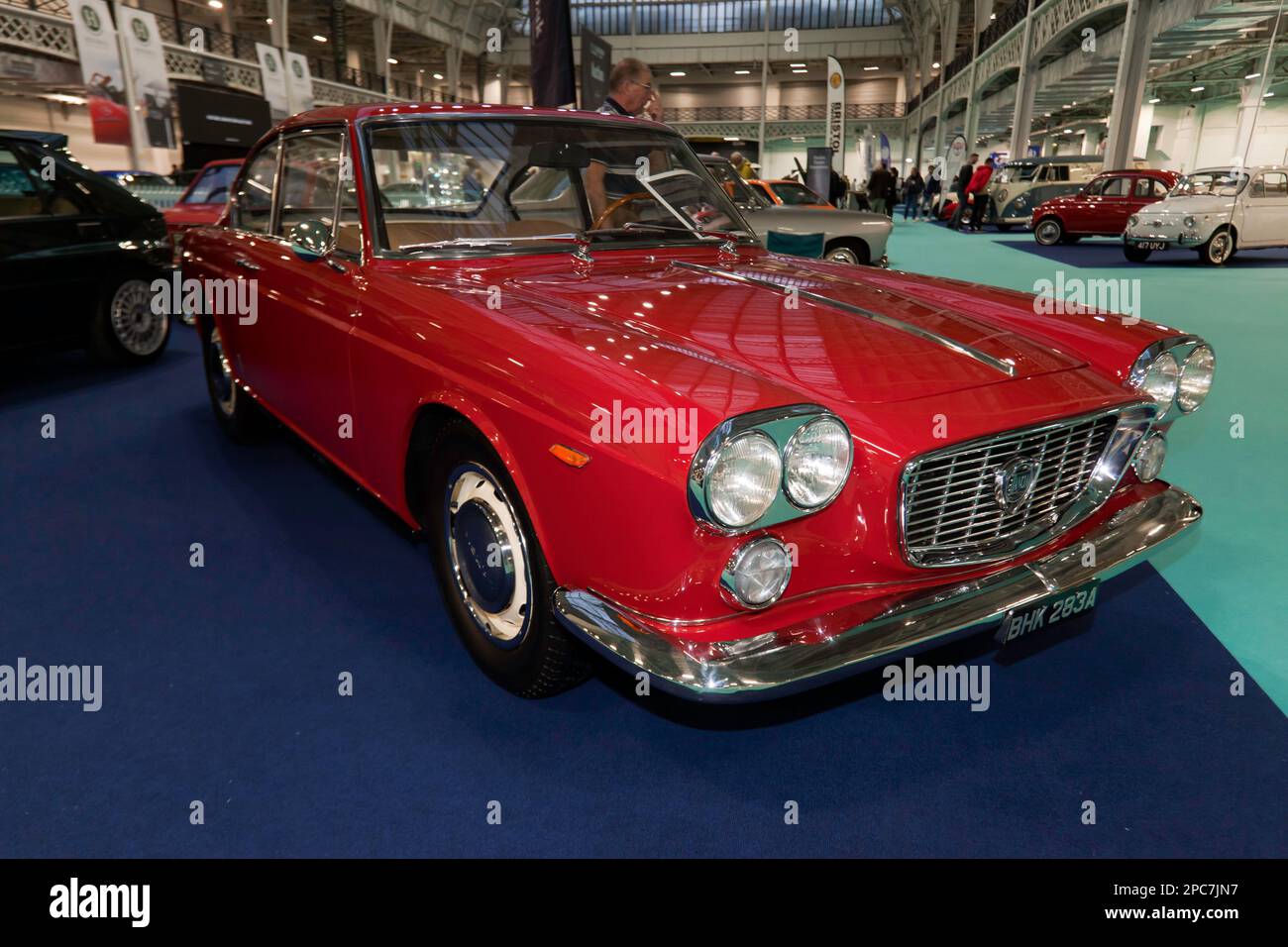 Three-quarters front view of a Red, 1963,  Lancia Flavia 1500 Coupé, on display at the 2023 London Classic Car Show Stock Photo