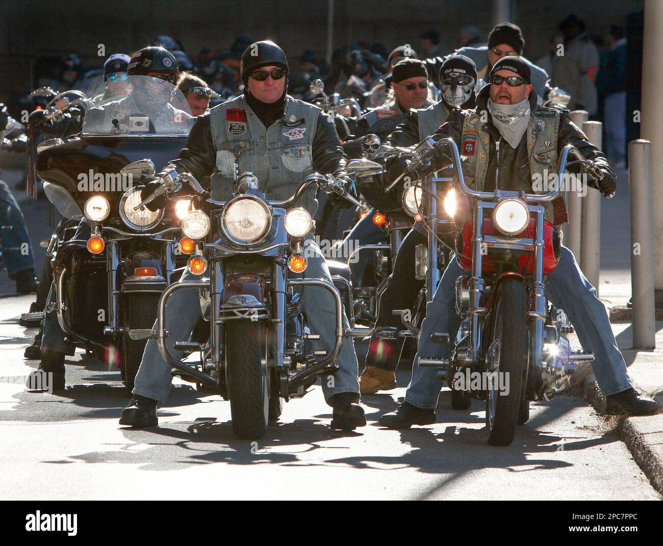 Members of the motorcycle club the Centurions rev their engines in an