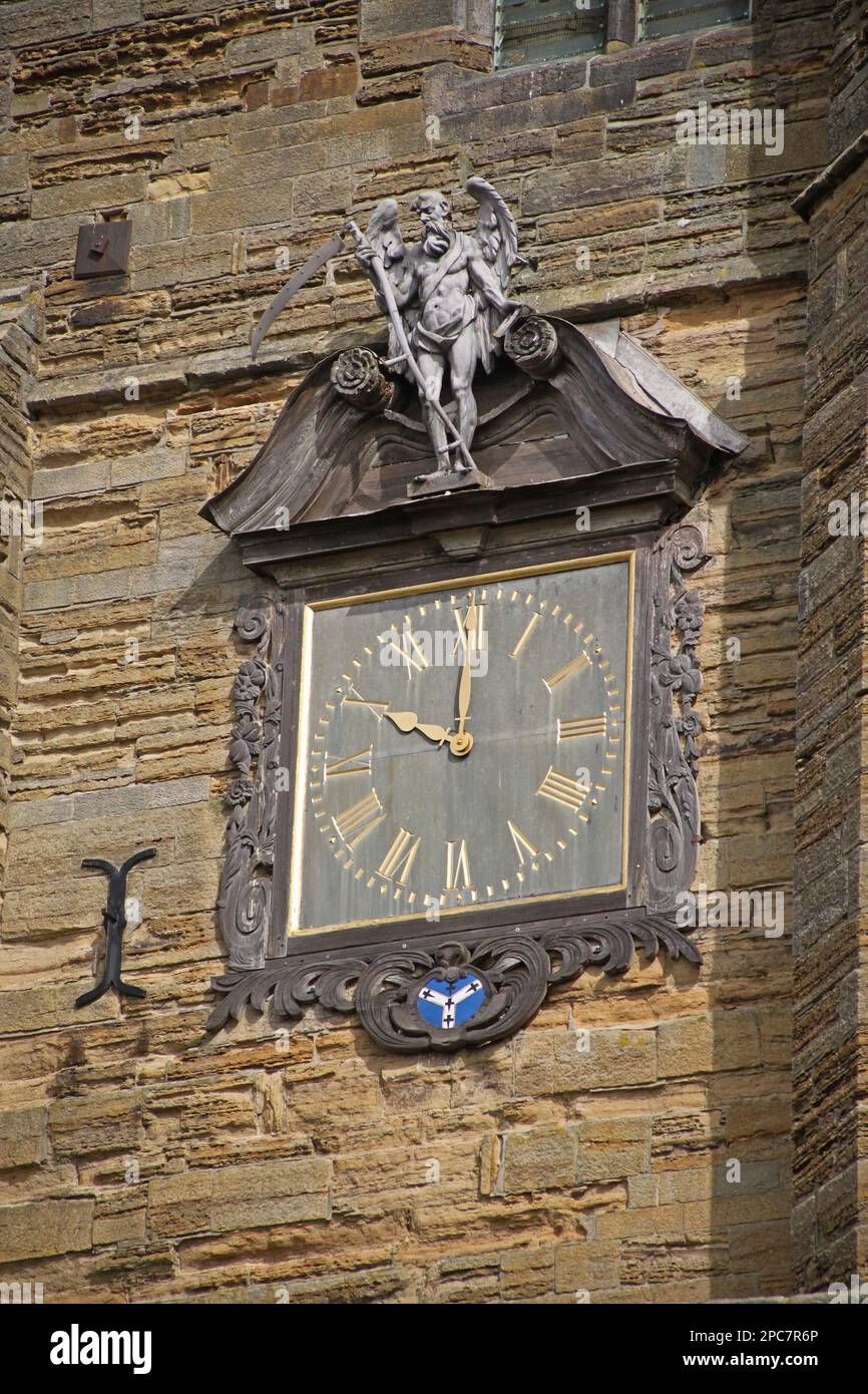 Decorative clock with 'Old Father Time' on church tower, Cranbrook