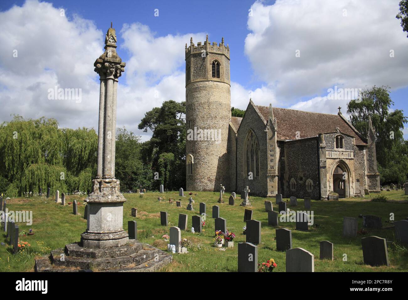Memorial cross in graveyard, church with Norman round-tower, St. Mary's Church, Rickinghall Inferior, Suffolk, England, United Kingdom Stock Photo