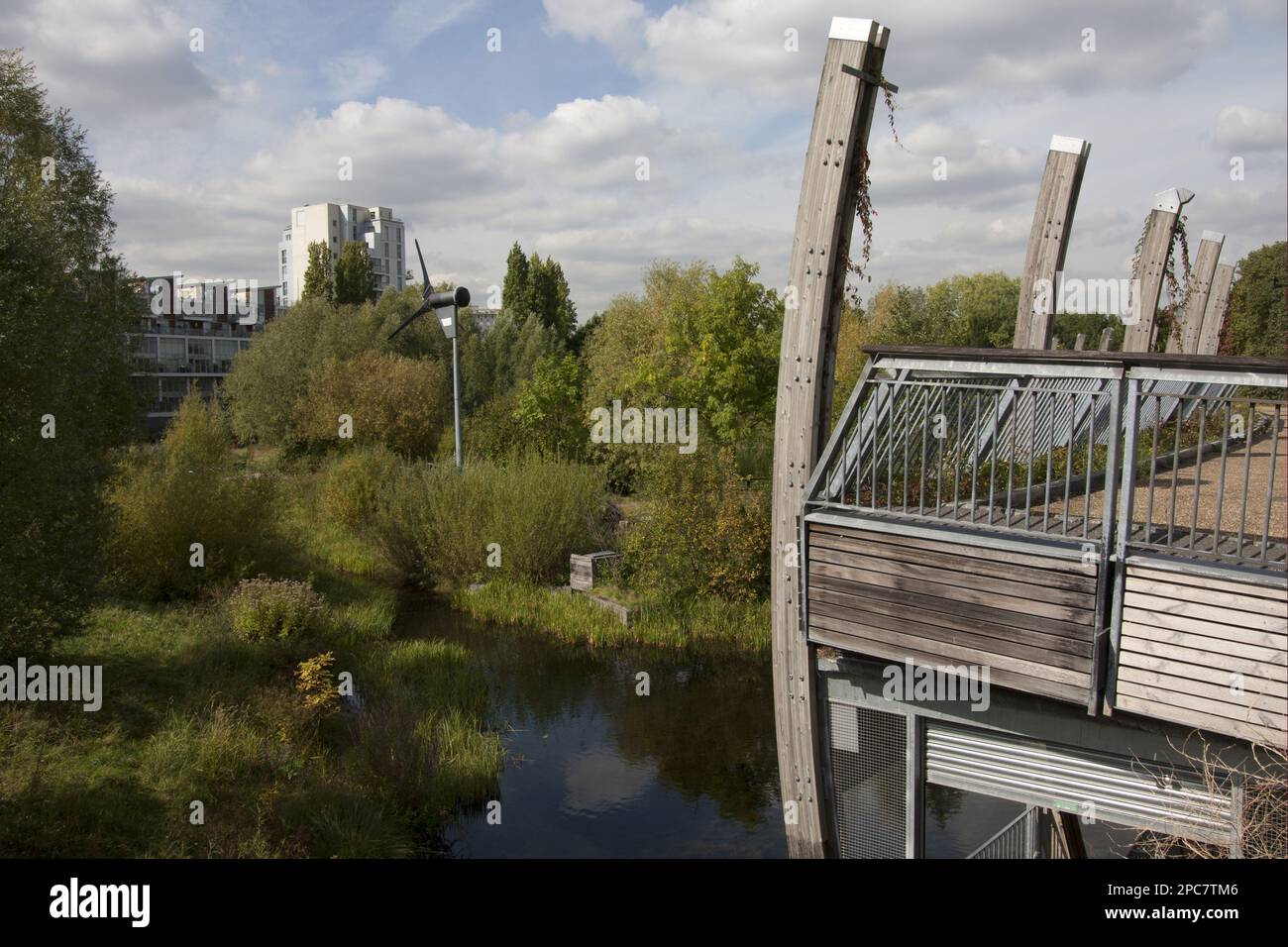 View of the Ecology Park with wetland habitat and wind turbine, The