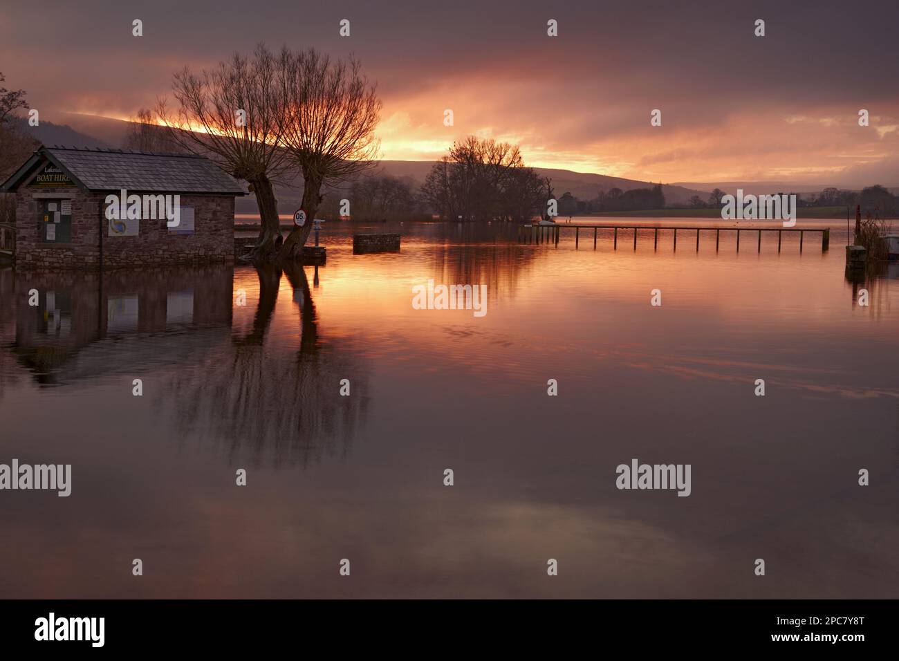 View of the lake at sunrise at high water level, Llangorse Lake, Brecon Beacons N. P. Powys, Wales, United Kingdom, Europe Stock Photo