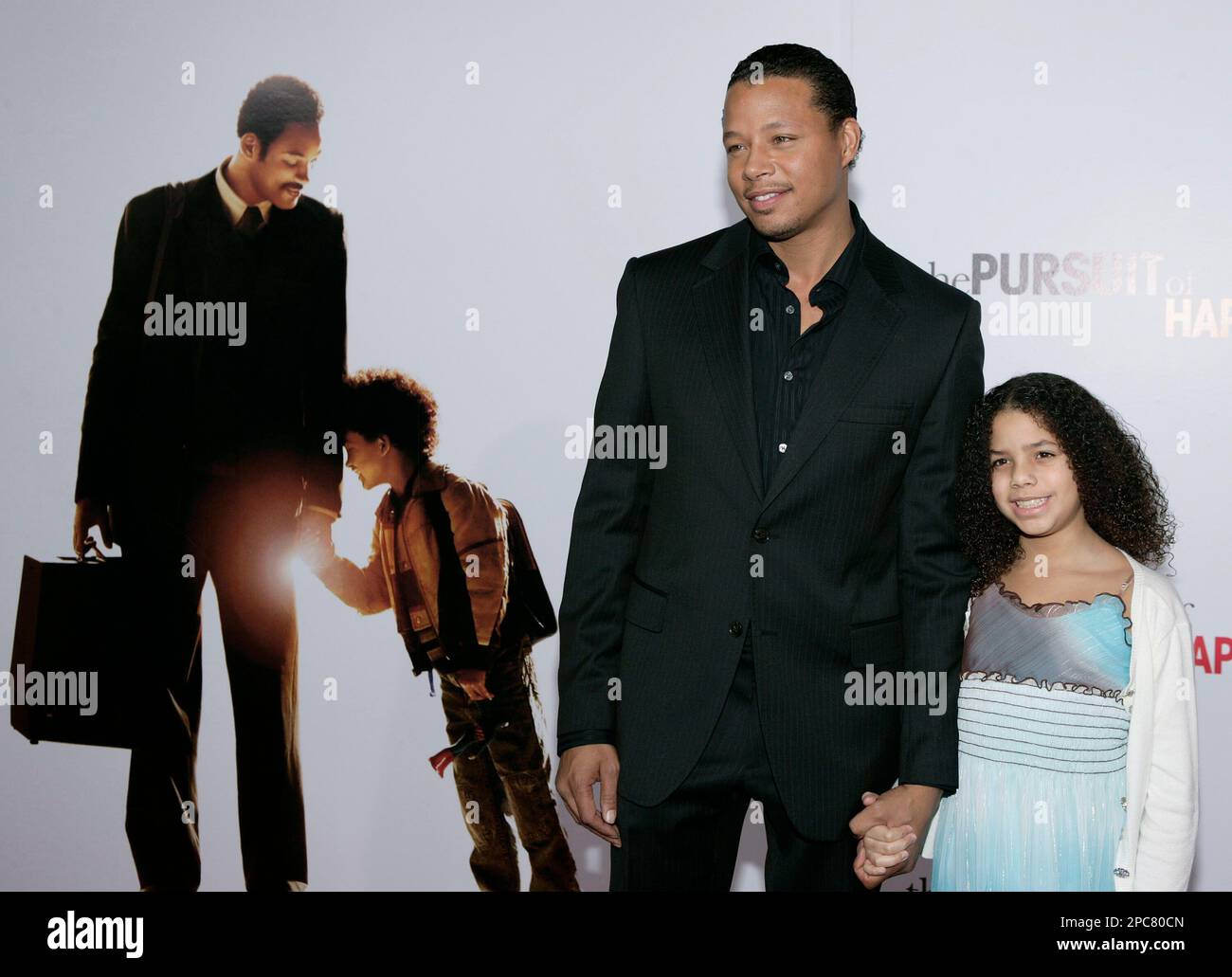 Actor Terrence Howard, left, and his daughter, Heavenly, arrive at the