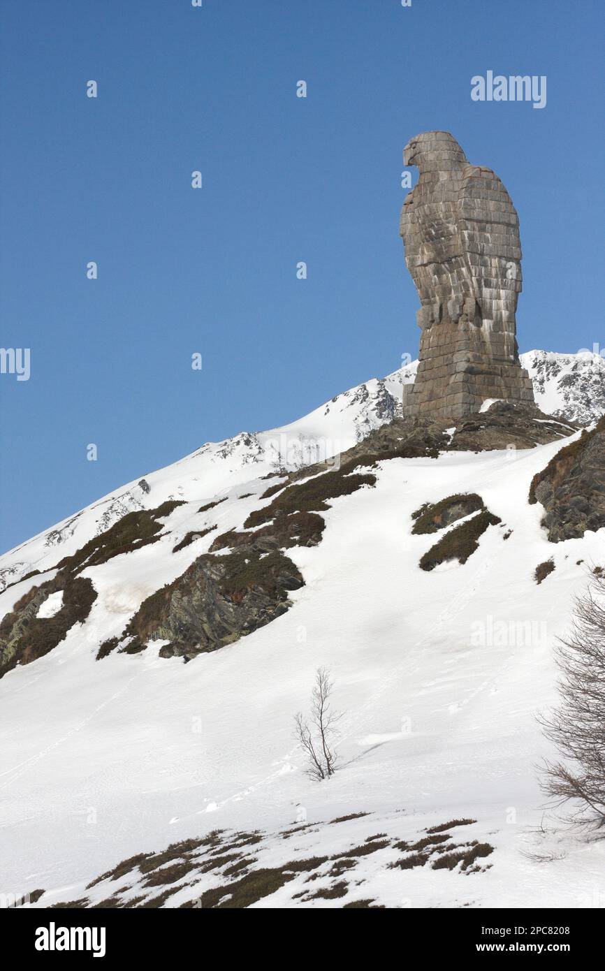 Rock Eagle Monument, in the snow at the top of the pass, Simplon Pass, Swiss Alps, Switzerland