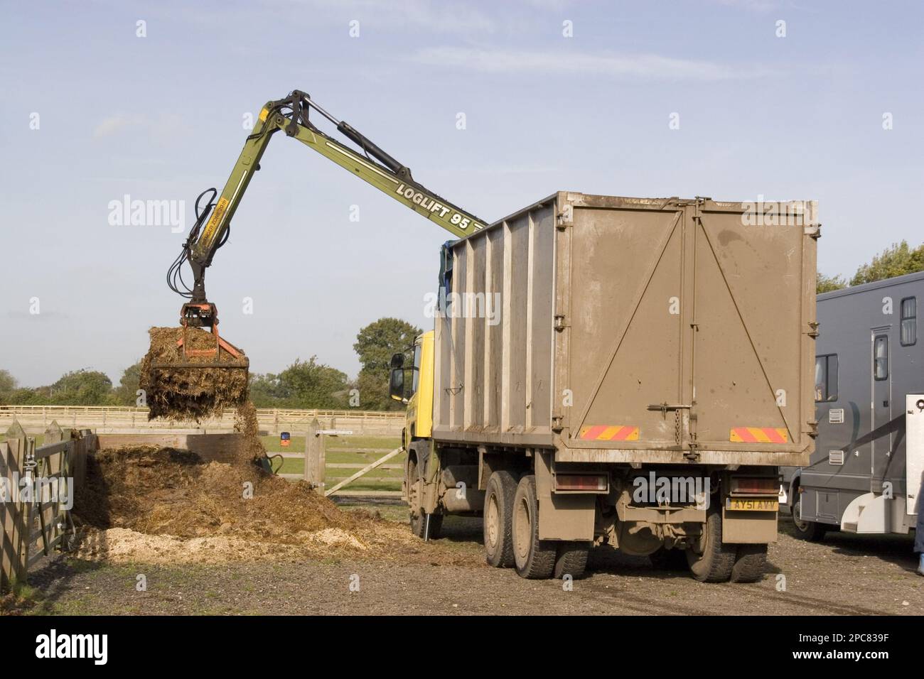 Removal of horse manure from the stable yard Stock Photo Alamy
