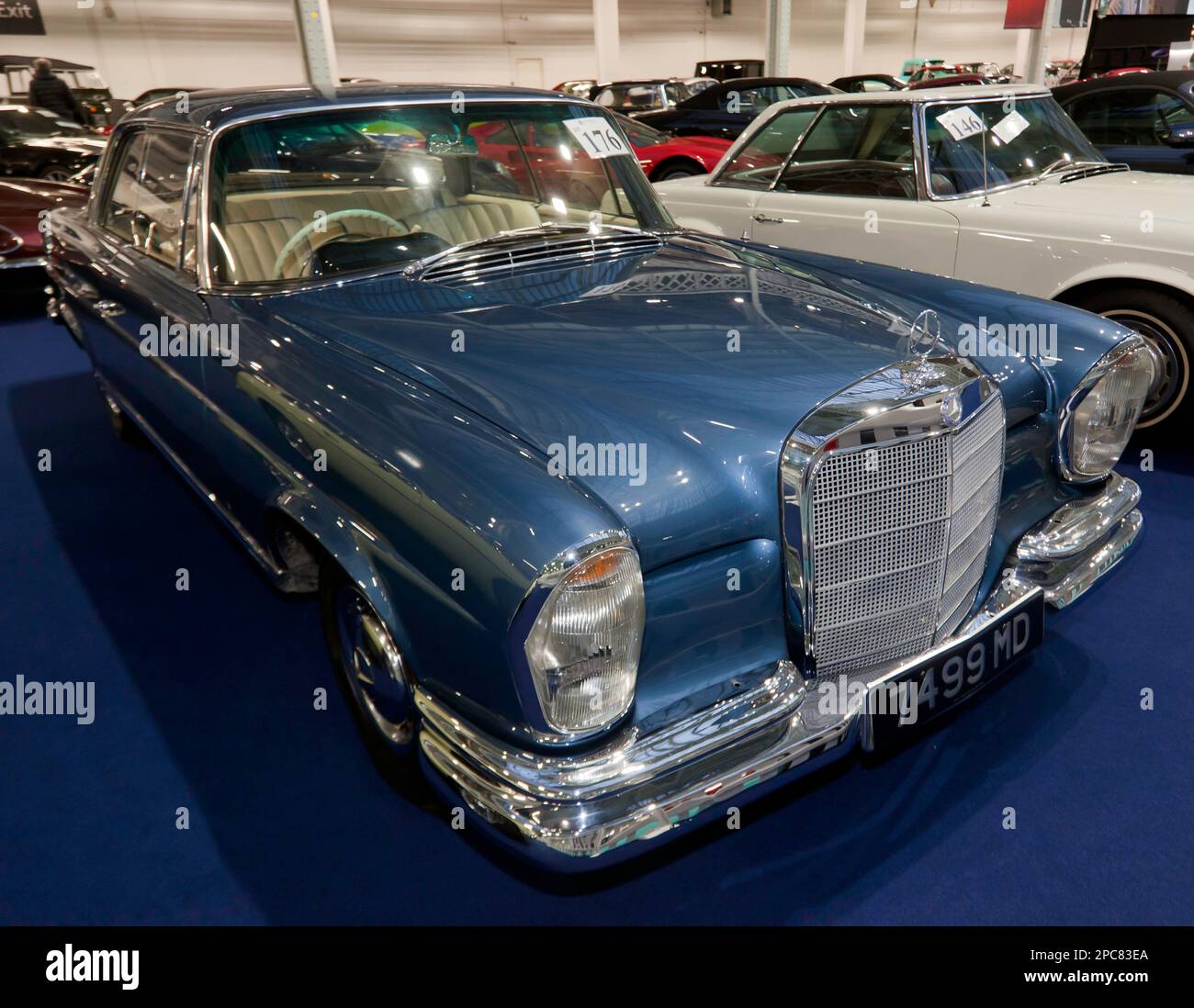 Three-Quarters Front View of  a Blue, 1962, Mercedes-Benz 220SE,  part of the 2023 London Classic Car Auction at Olympia, London Stock Photo