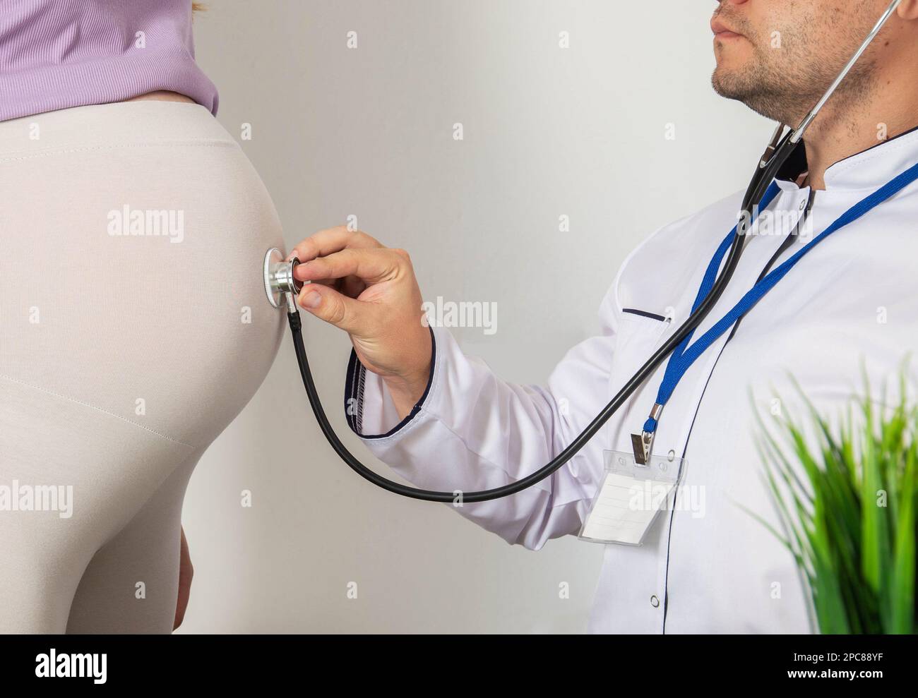 Doctor obstetrician gynecologist using a stethoscope for pregnant women