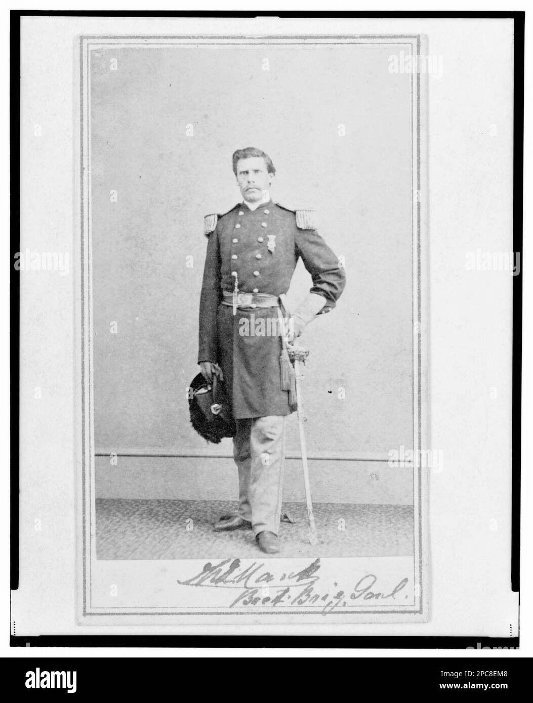 Brigadier General William G. Mank, Union officer in the 32nd Indiana Regiment, full-length portrait, standing, facing front / Alex Gardner, Photographer for the Army of the Potomac.. Title devised by Library staff, In: Adolph Metzner photograph album ., no. 20, Color laser copy reference surrogate, showing front and back of photo, filed with finding aids for LOT 8751 in P&P Reading Room, Three cent stamp on verso. Mank, William G, 1831-1887, Military service, United States, Army, Indiana Infantry Regiment, 32nd (1861-1865), People, UnifForms, 1860-1870, United States, History, Civil War, 1861- Stock Photo
