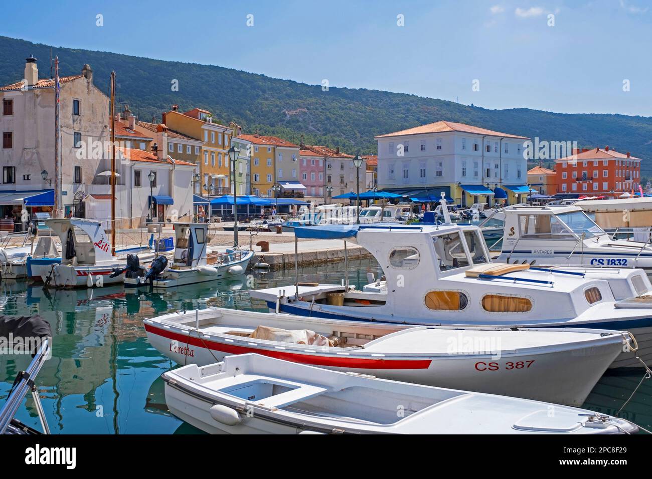 Fishing boats docked in the harbour / port of the town Cres on the island Cherso in the Kvarner Bay, Primorje-Gorski Kotar County, Croatia Stock Photo