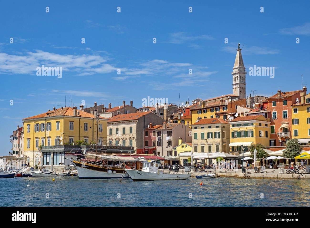Waterfront showing boats and sailing ship in harbour of the city Rovinj / Rovigno, seaside resort along the north Adriatic Sea, Istria County, Croatia Stock Photo