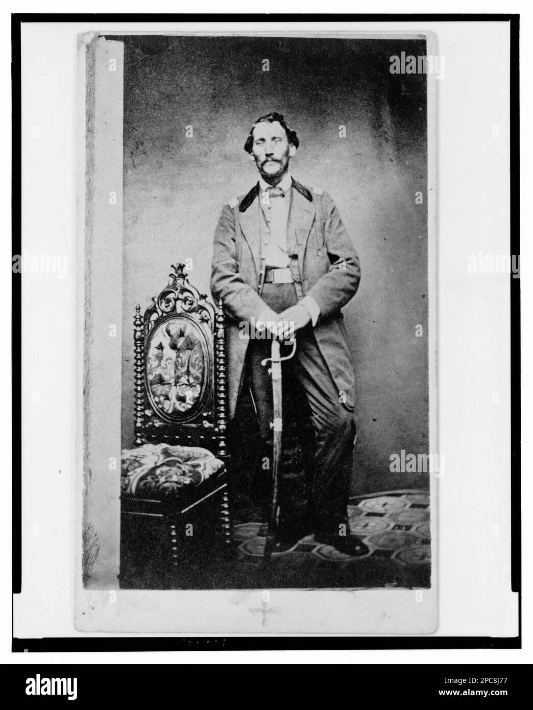 Captain John D. Ritter, Union officer in the 32nd Indiana Regiment, full-length portrait, standing, facing front / Runnion's Art Gallery, Indianapolis.. Title devised by Library staff, In: Adolph Metzner photograph album ., no. 36, Color laser copy reference surrogate, showing front and back of photo, filed with finding aids for LOT 8751 in P&P Reading Room. Ritter, John D, Military service, United States, Army, Indiana Infantry Regiment, 32nd (1861-1865), People, UnifForms, 1860-1870, United States, History, Civil War, 1861-1865, Military officers, Union. Stock Photo