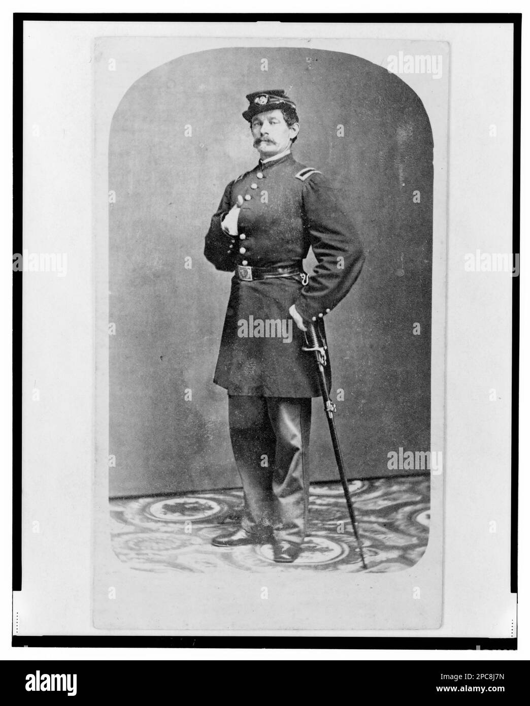 1st Lieutenant August Bitter, Union officer in the 24th Illinois Regiment, full-length portrait, standing, facing front / Wallis Bro., 117 Lake St., Chicago.. Title devised by Library staff, In: Adolph Metzner photograph album ., no. 50, Two cent stamp on verso, Color laser copy reference surrogate, showing front and back of photo, filed with finding aids for LOT 8751 in P&P Reading Room. United States, Army, Illinois Infantry Regiment, 24th (1861-1864), People, UnifForms, 1860-1870, United States, History, Civil War, 1861-1865, Military officers, Union. Stock Photo