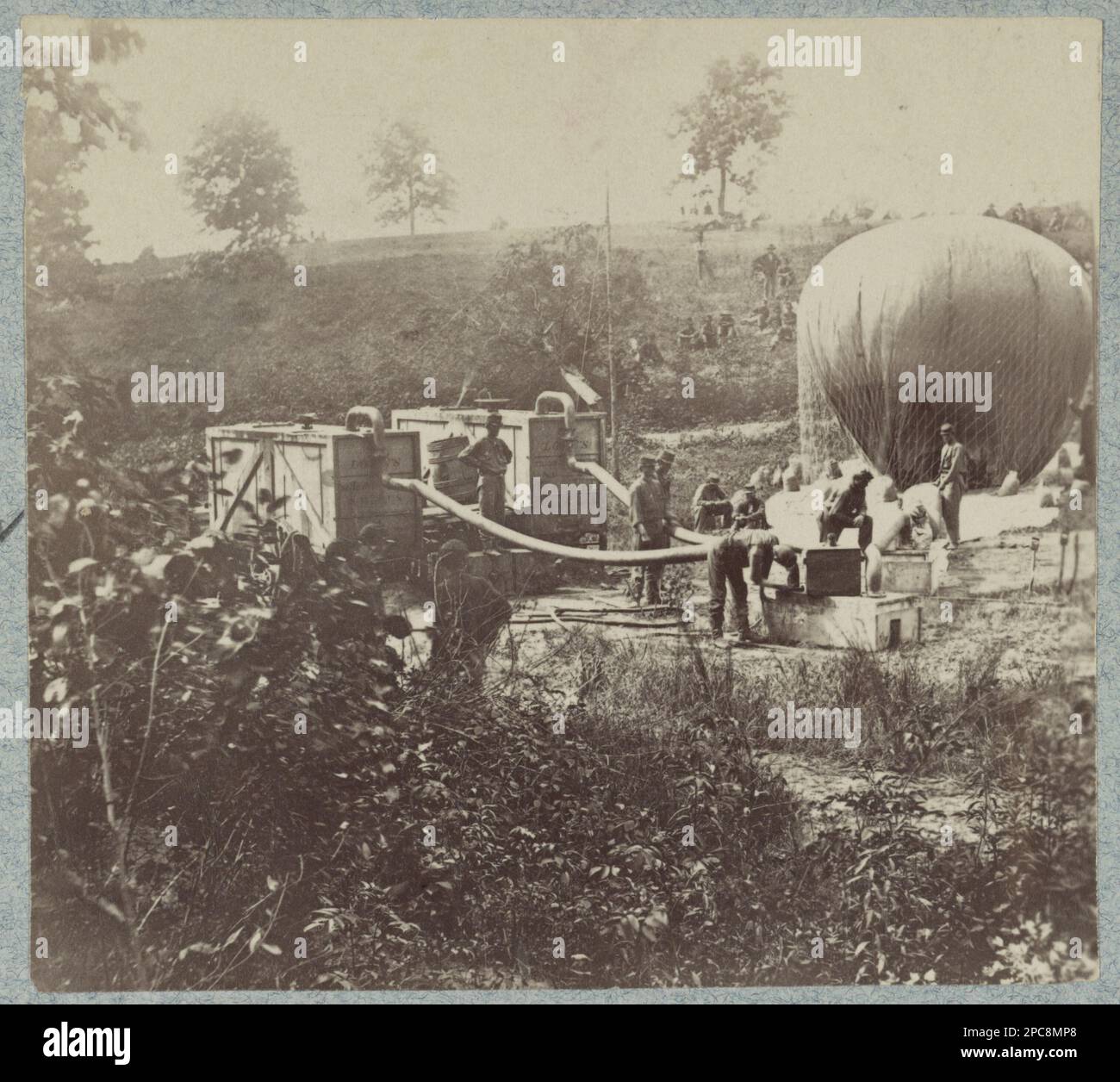 This photograph captures the historic moment when the balloon Intrepid was inflated to conduct reconnaissance of the Battle of Fair Oaks during the Civil War. The image is part of a series of six photographs documenting Prof. Lowe's military balloons near Gaines Mill, Virginia. As one of the earliest instances of aerial reconnaissance in warfare, this image provides a glimpse into the innovative tactics used during the Civil War. It is a testament to the resourcefulness of both sides and their constant quest for an advantage on the battlefield. Stock Photo
