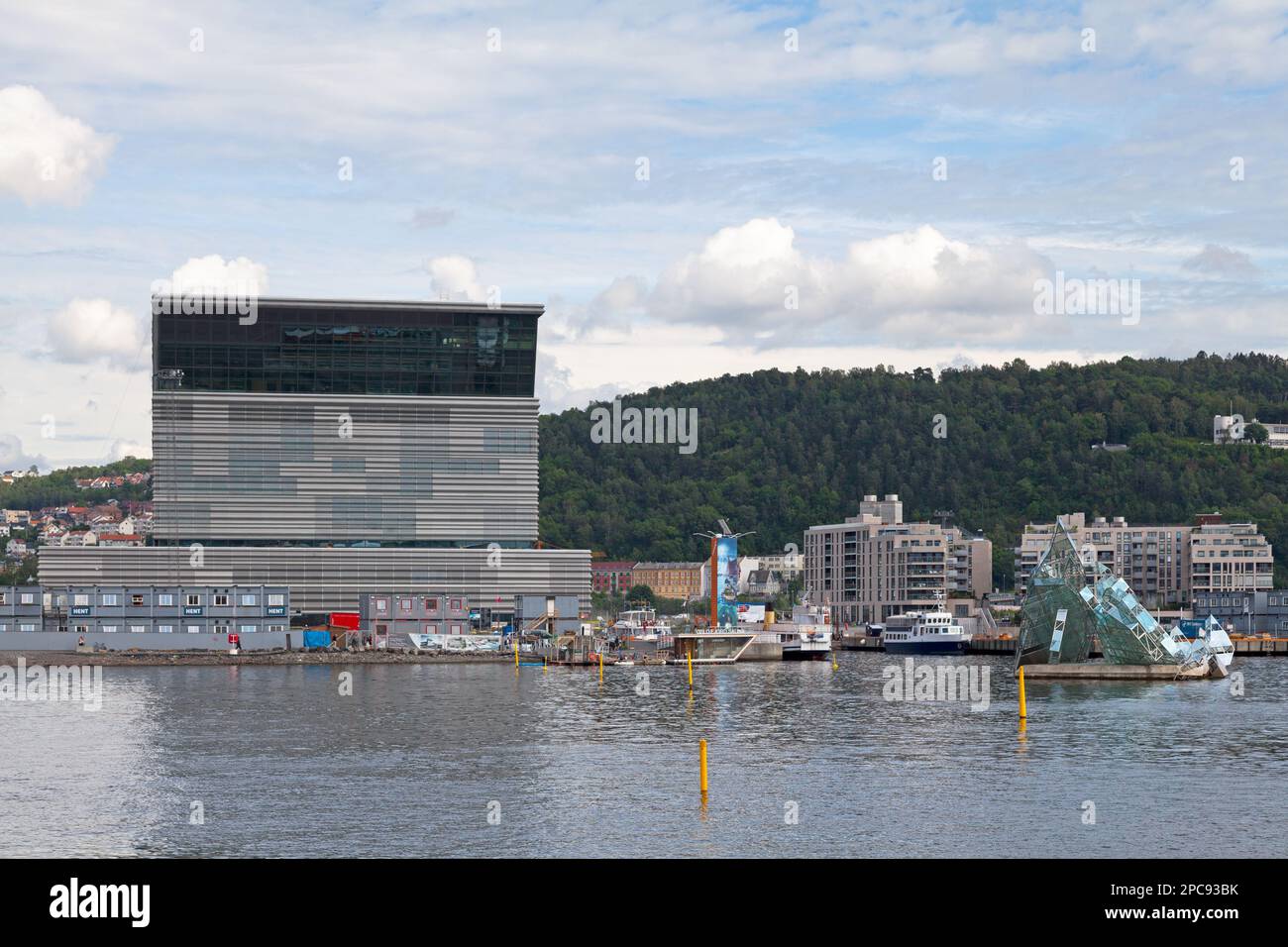 Oslo, Norway - June 26 2019: The Munch Museum at Bjørvika on the waterfront, next to the Oslo Opera House and She Lies. Stock Photo
