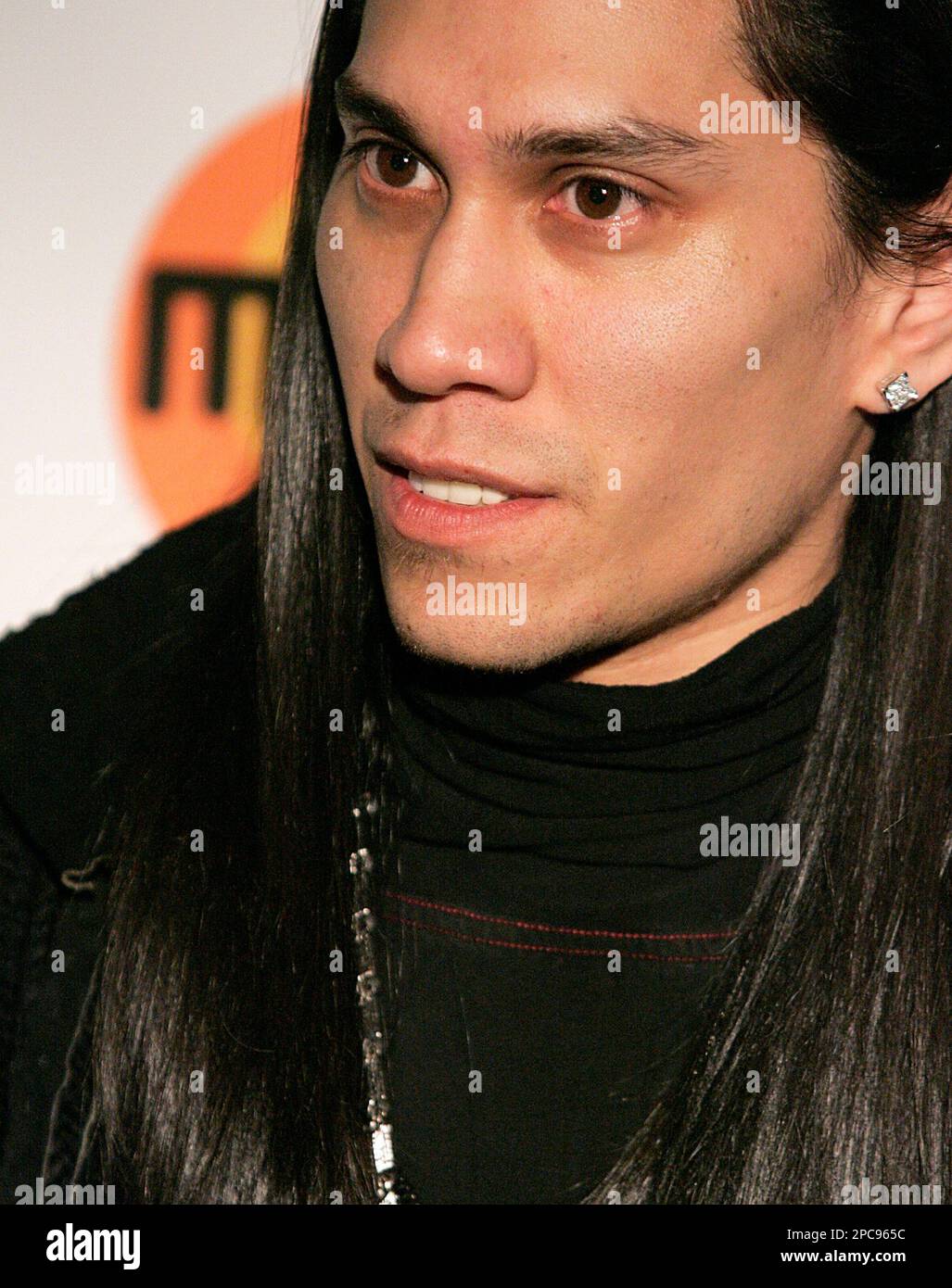 Musician Taboo poses on arrival at the 32nd birthday celebration for