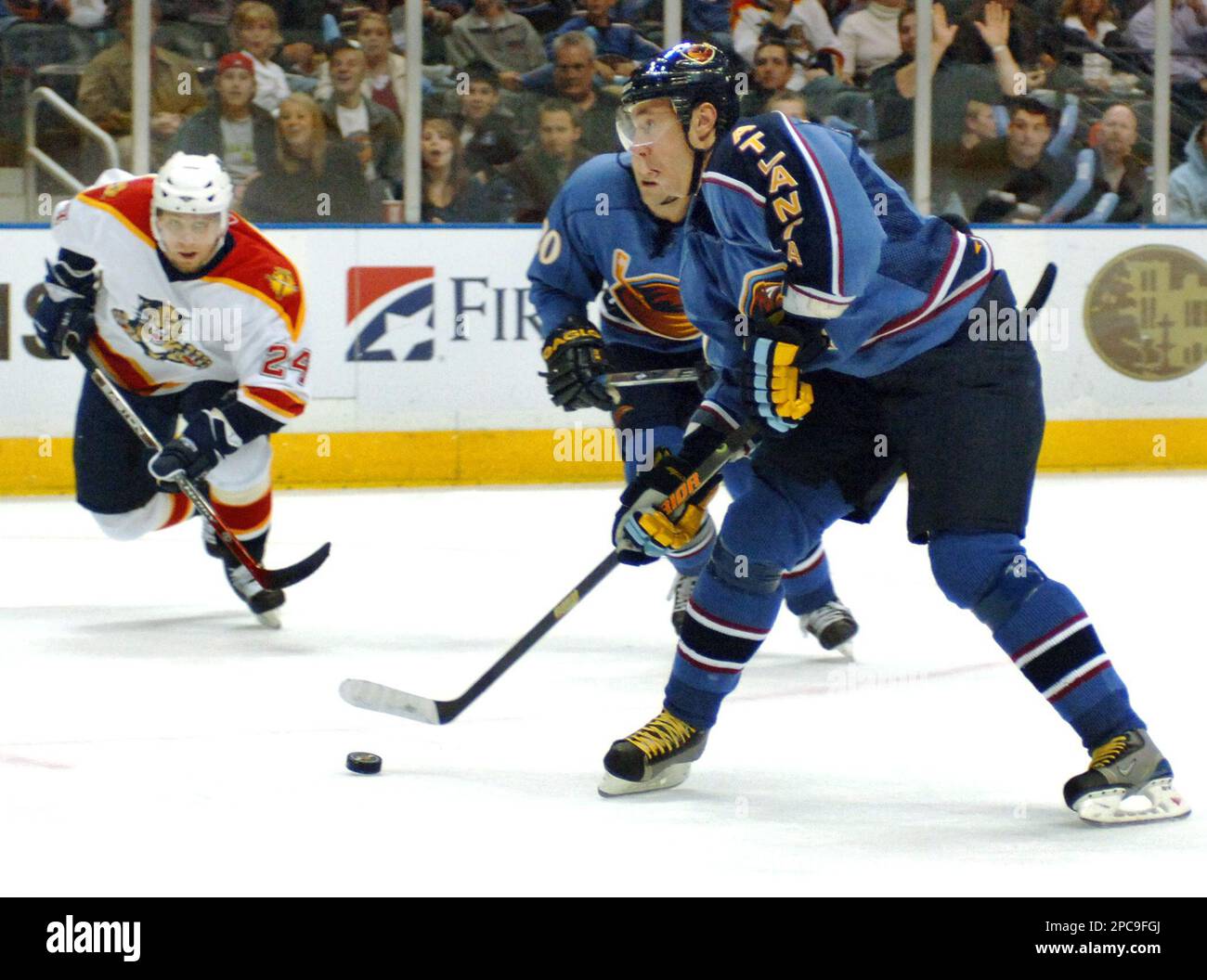 Atlanta Thrashers left wing Ilya Kovalchuk, center, of Russia, powers up  for a goal as Florida Panthers defenseman Ruslan Salei (24), of Belarus,  skates in to defend during the first period of