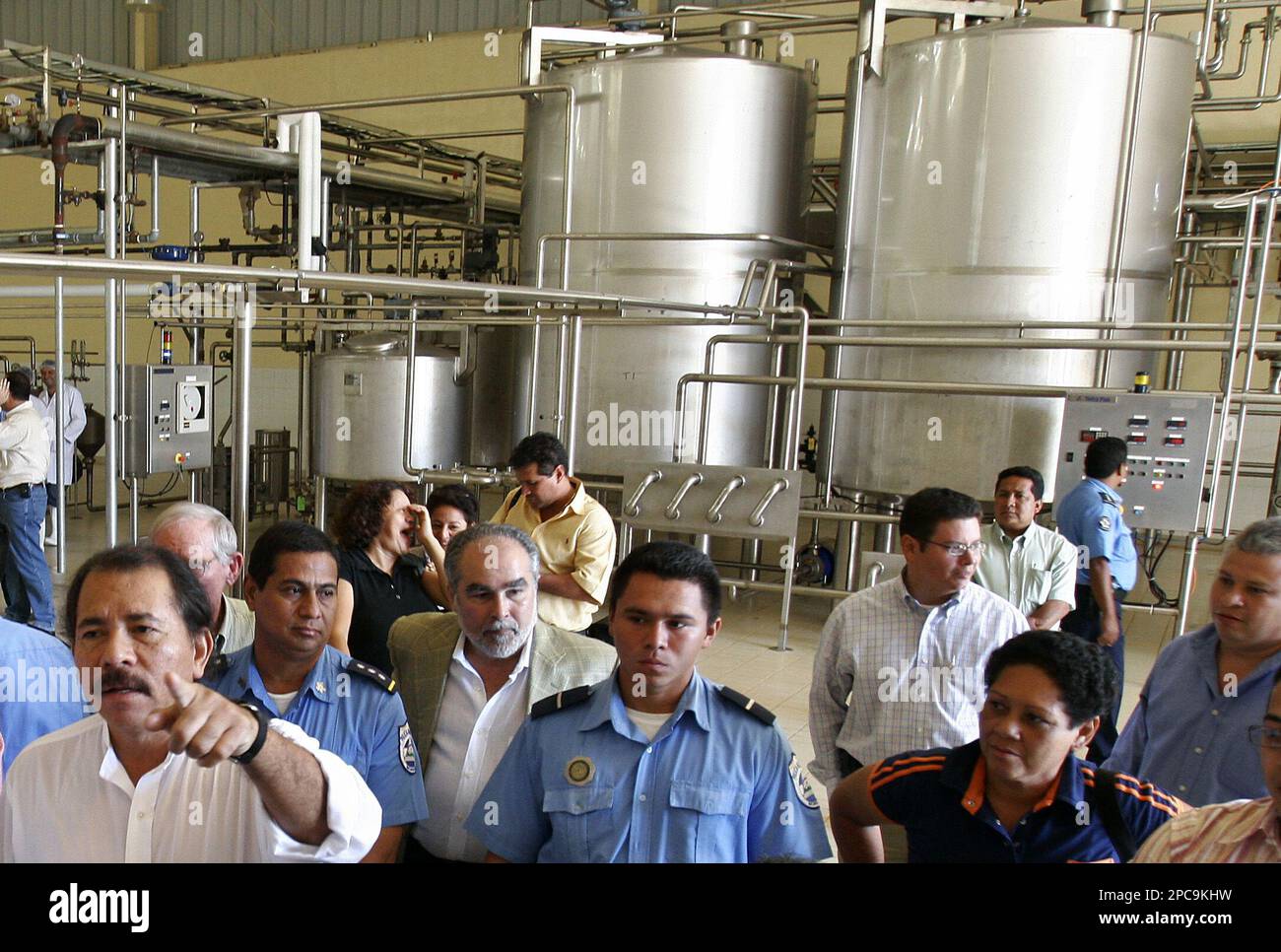 Nicaraguan President-elect Daniel Ortega, left, visits a milk ...