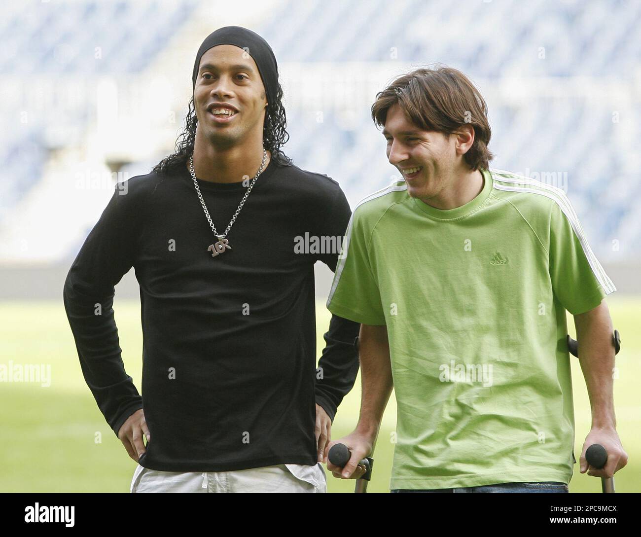 FC Barcelona's soccer players Leo Messi, right, and Ronaldinho laugh ...