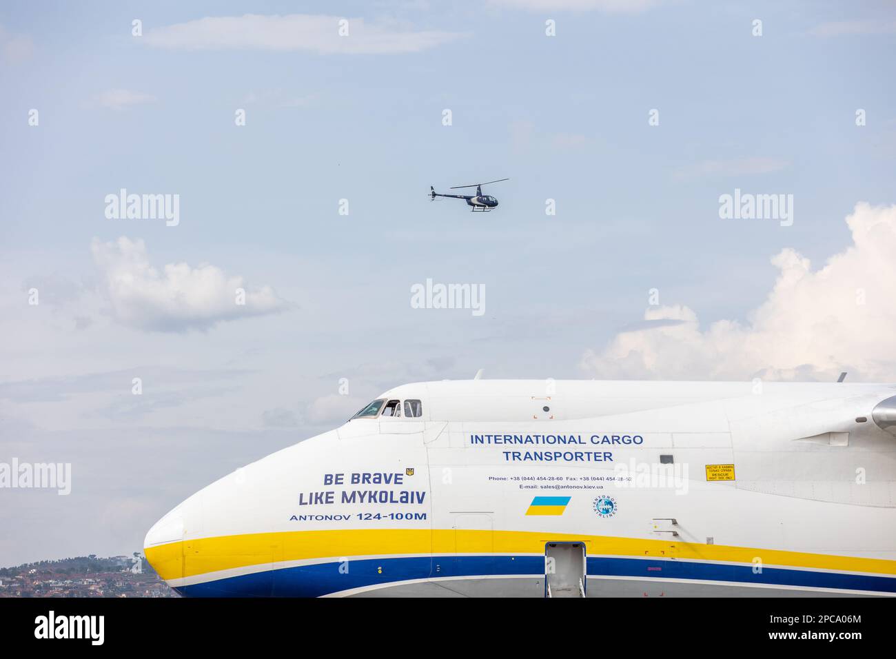 Kigali, Rwanda. 12th Apr, 2023. An Antonov 124-100M with the inscription 'Be Brave like Mykolaiv' lands at the international airport with special containers from Biontech on board. The arrival of the first special containers in Rwanda brings the vaccine production of the Mainz-based company Biontech on African soil a little closer. Six special shipping containers arrived by plane, according to Biontech. The six containers will form a so-called 'BioNTainer', a modular production unit, in a hall on a Biontech site in a special economic zone in Kigali. Credit: Jean Bizi/dpa/Alamy Live News Stock Photo