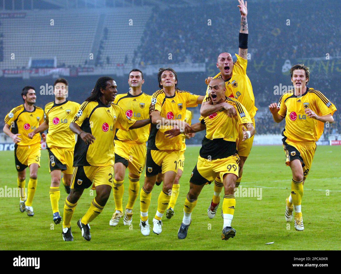 AEK player Julio Cesar, third right, celebrates his goal with Bruno  Cirillo, of Italy, second right, and other teammates, during their match  against AC Milan, in group H Champions League soccer match