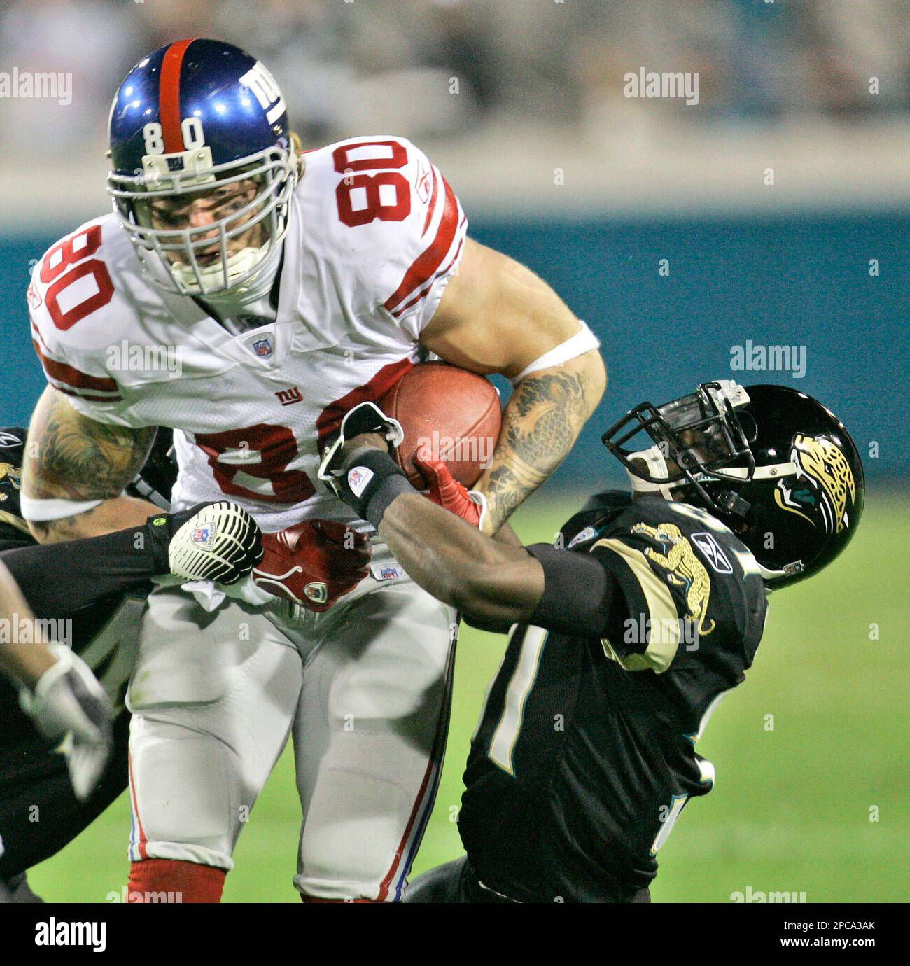 New York Giants Jeremy Shockey and Eli Manning (right) watch the action  from the bench in the fourth quarter. The Vikings defeated the Giants  41-17, at Giants Stadium in East Rutherford, New