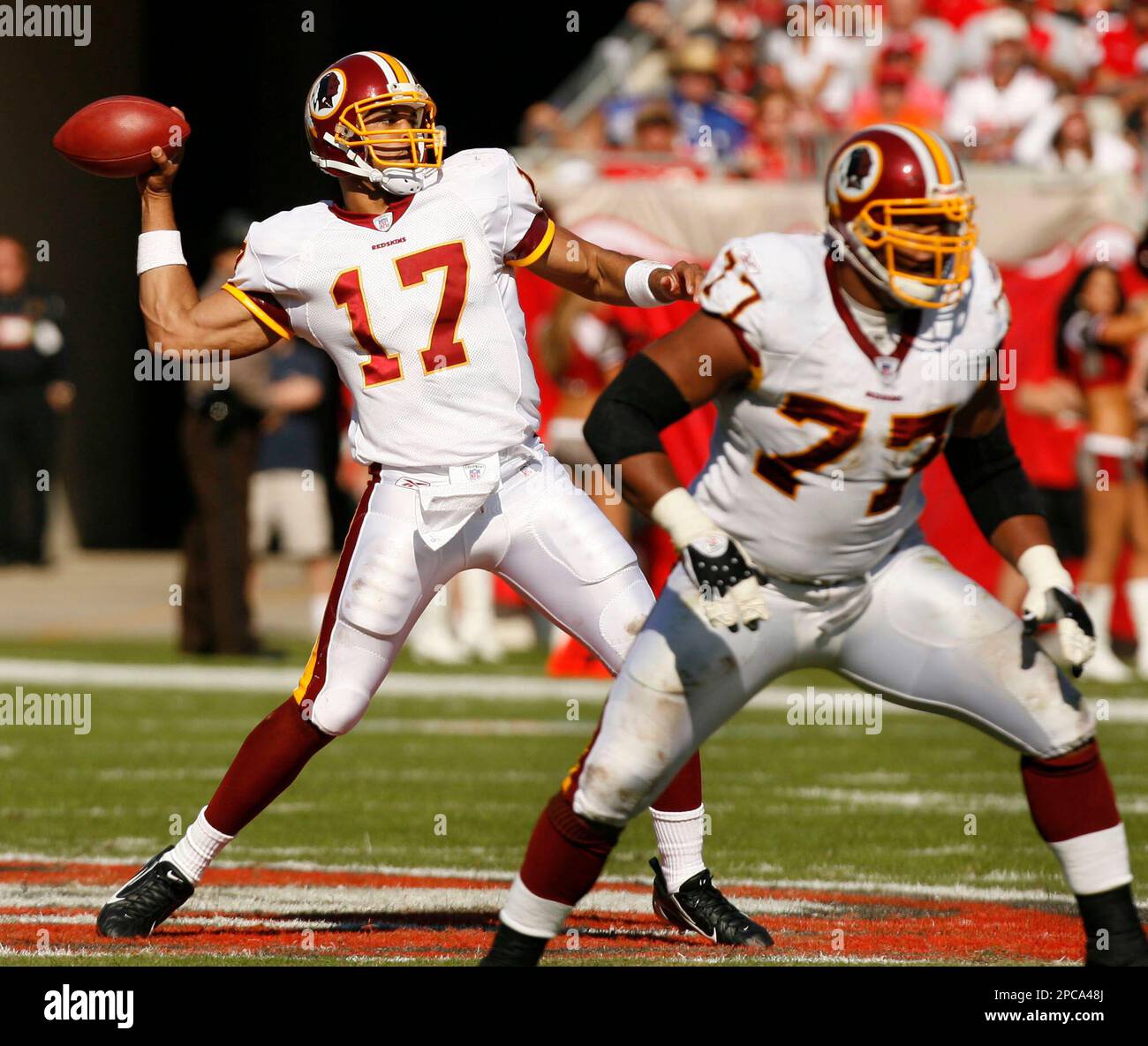 FILE ** Washington Redskins quarterback Jason Campbell (17) throws a pass  behind a block from the Redskins' Randy Thomas during the second quarter of  their NFL football game against the Tampa