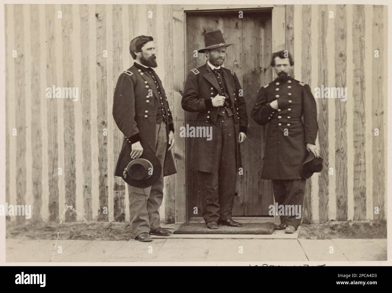 Brigadier General John A. Rawlins, left, Lieutenant General U.S. Grant, center, and Lieutenant Colonel Theodore S. Bowers at City Point, Virginia. Title devised by library staff, Identification of officers and location from photograph from the same negative in the MOLLUS-MASS Civil War Photographs Collection. Rawlins, John A, (John Aaron), 1831-1869, Grant, Ulysses S, (Ulysses Simpson), 1822-1885, Bowers, Theodore Shelton, 1832-1866, United States, History, Civil War, 1861-1865. Stock Photo