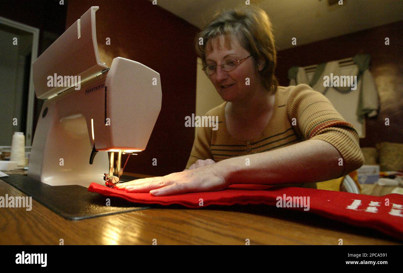 Debbie Cebulla sews a Christmas stocking inside her Norton Shores, Mich