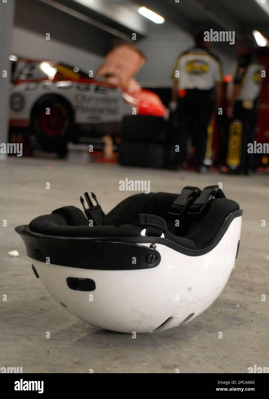 https://c8.alamy.com/comp/2PCA660/a-helmet-lies-discarded-on-the-floor-as-pit-crew-members-pack-their-gear-for-the-last-time-in-2006-following-the-season-finale-ford-400-auto-race-at-homestead-miami-speedway-in-homestead-fla-sunday-nov-19-2006-greg-biffle-won-the-race-and-jimmie-johnson-won-the-championshipap-photopaul-kizzle-2PCA660.jpg