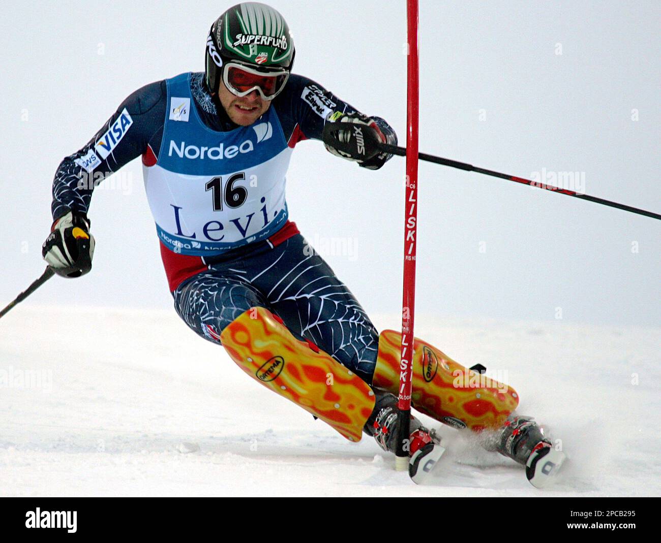 Usa's Bode Miller, the former World Cup overall winner, slaloms past a pole  during the men's ski World Cup opening slalom in Levi, Finland, Sunday,Nov.  12 2006. Austria's Benjamin Raich, who won