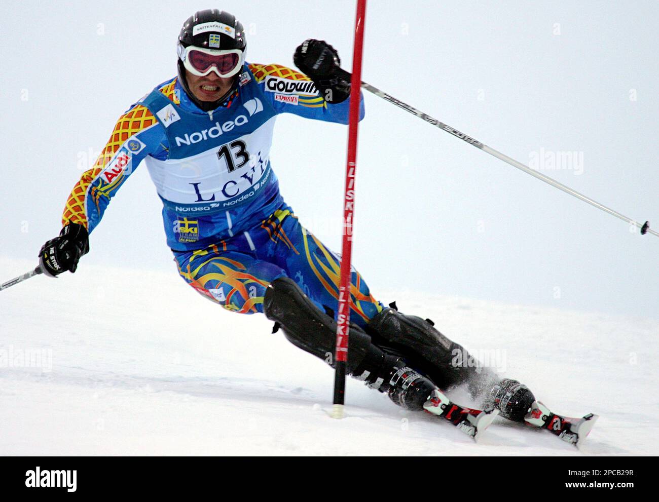 Sweden's Andre Myhrer slaloms past a pole during the men's ski World