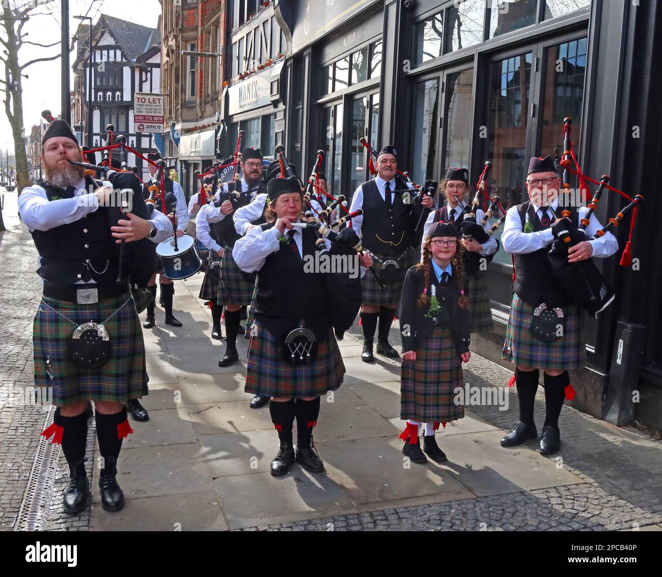 Pipe band at St Patricks Day 2023 Irish Community parade Orford Ln Warrington to Bridge Street IRA bombing memorial, Cheshire, UK Stock Photo