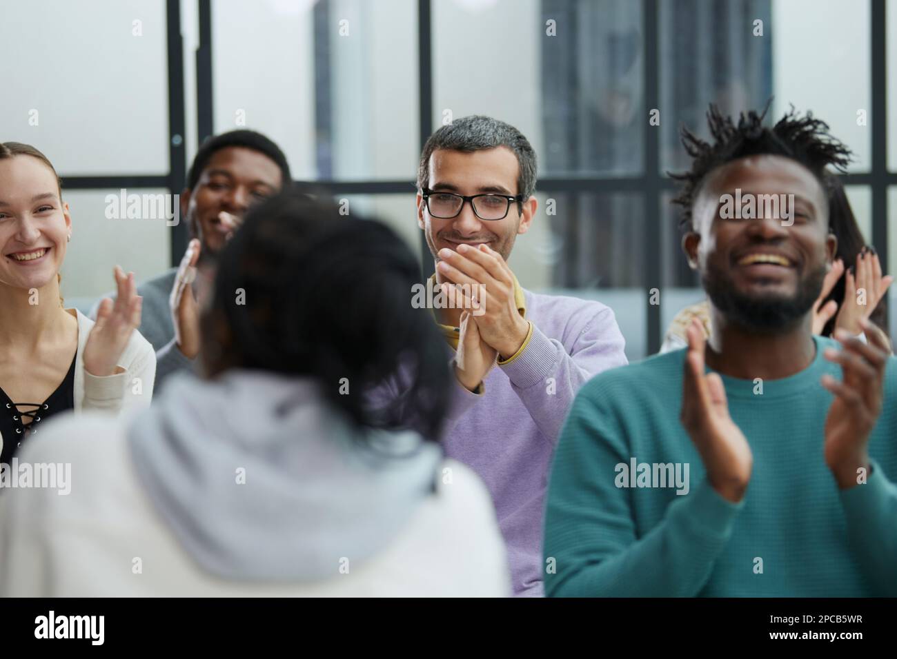 Young woman coach speaker giving flipchart presentation Stock Photo
