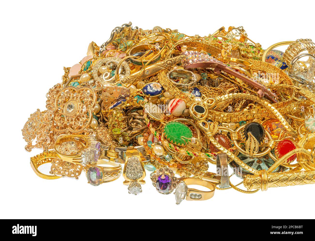Horizontal shot of a multicolored pile of vintage jewelry isolated on white. Stock Photo