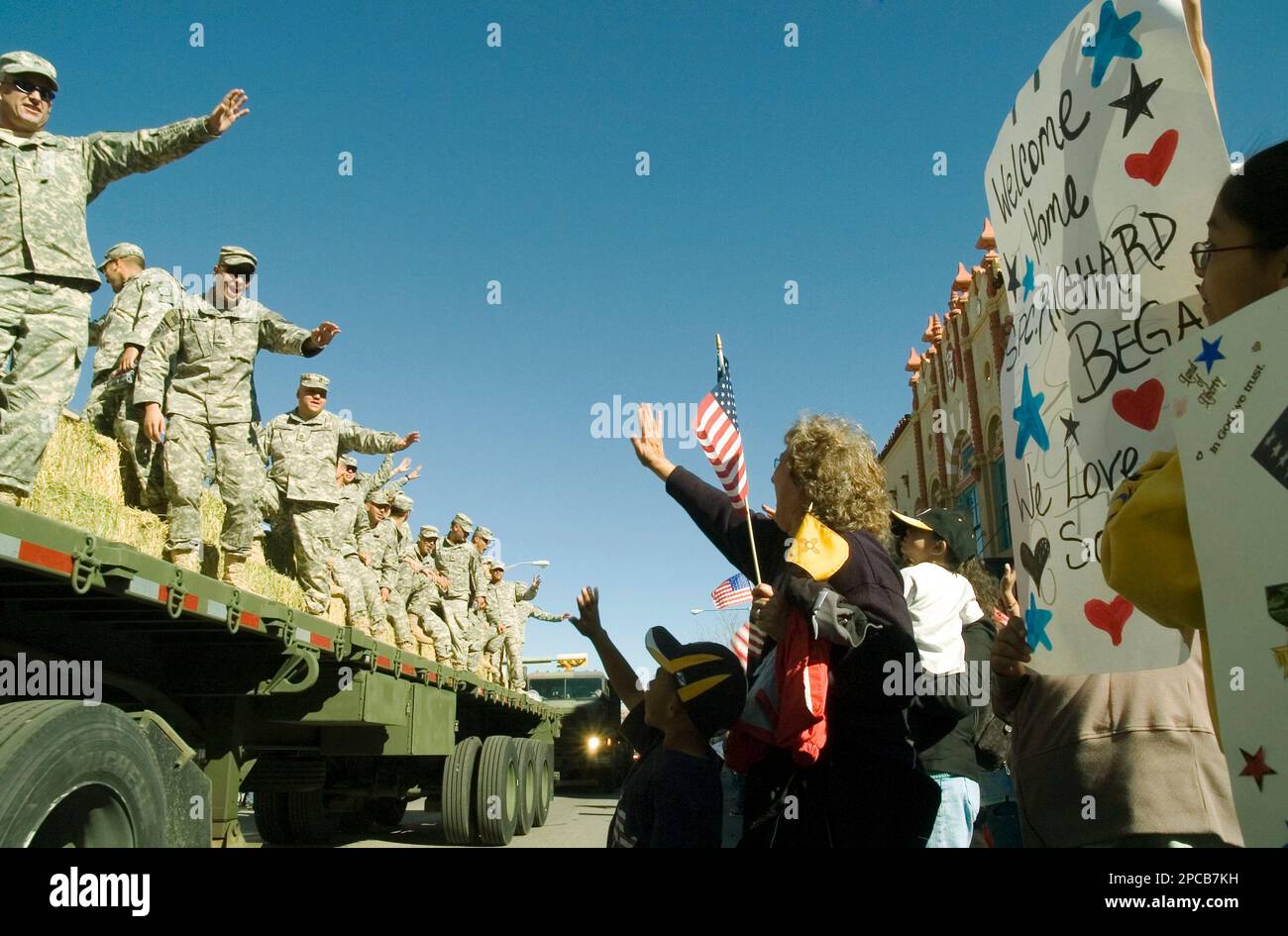 Family members cheer their returning loved ones with the New Mexico