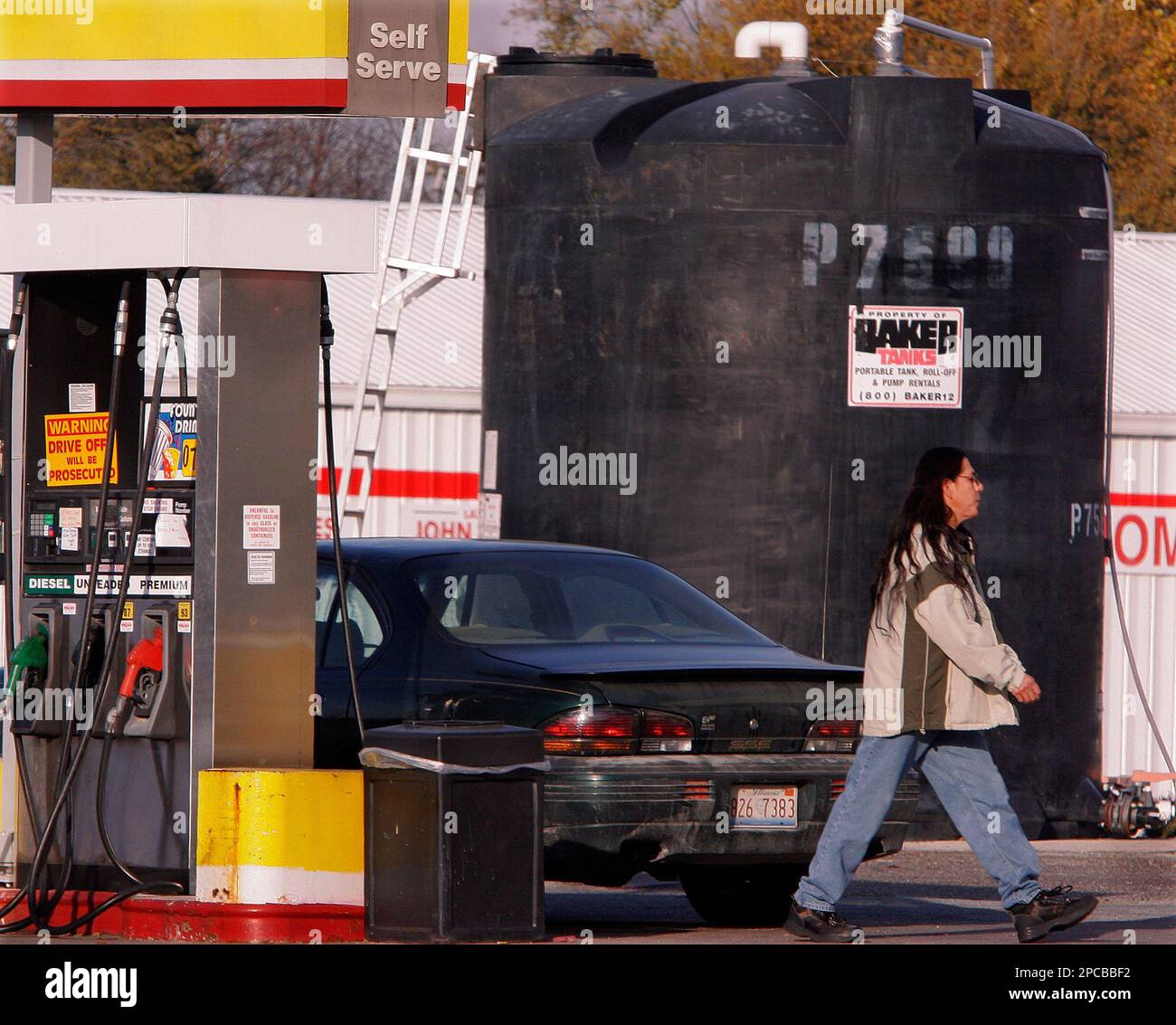 A groundwater contamination tank towers over patrons of the Andrew's