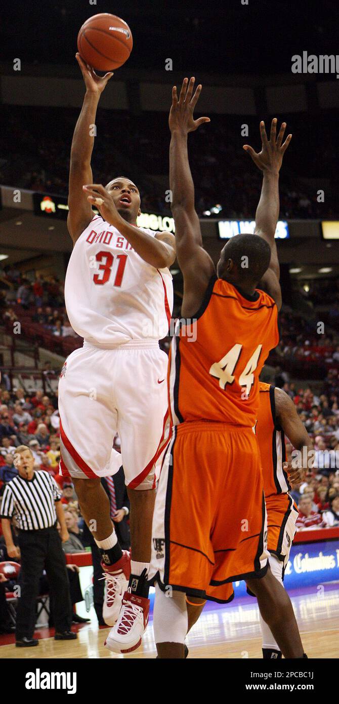 FILE ** Ohio State's Daequan Cook (31) shoots over Findlay's Frank Phillips  (44) during the second half of a exhibition college basketball game in  Columbus, Ohio, in this Nov. 1, 2006