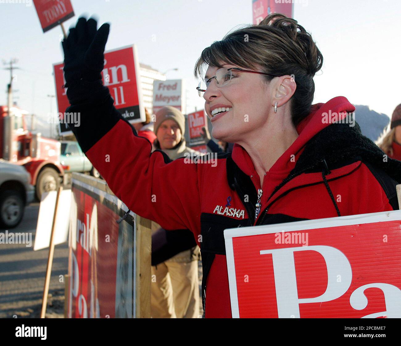 Republican gubernatorial candidate Sarah Palin waves to passing traffic