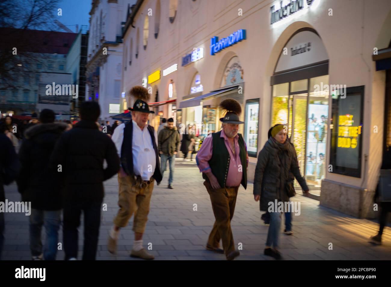 Munich, Germany. 11th Mar, 2023. Men wearing Lederhosen and hats. Though the inflation is still persisting the pedestrian zone in Munich, Germany is crowded with people going shopping on March 11, 2023. (Photo by Alexander Pohl/Sipa USA) Credit: Sipa USA/Alamy Live News Stock Photo