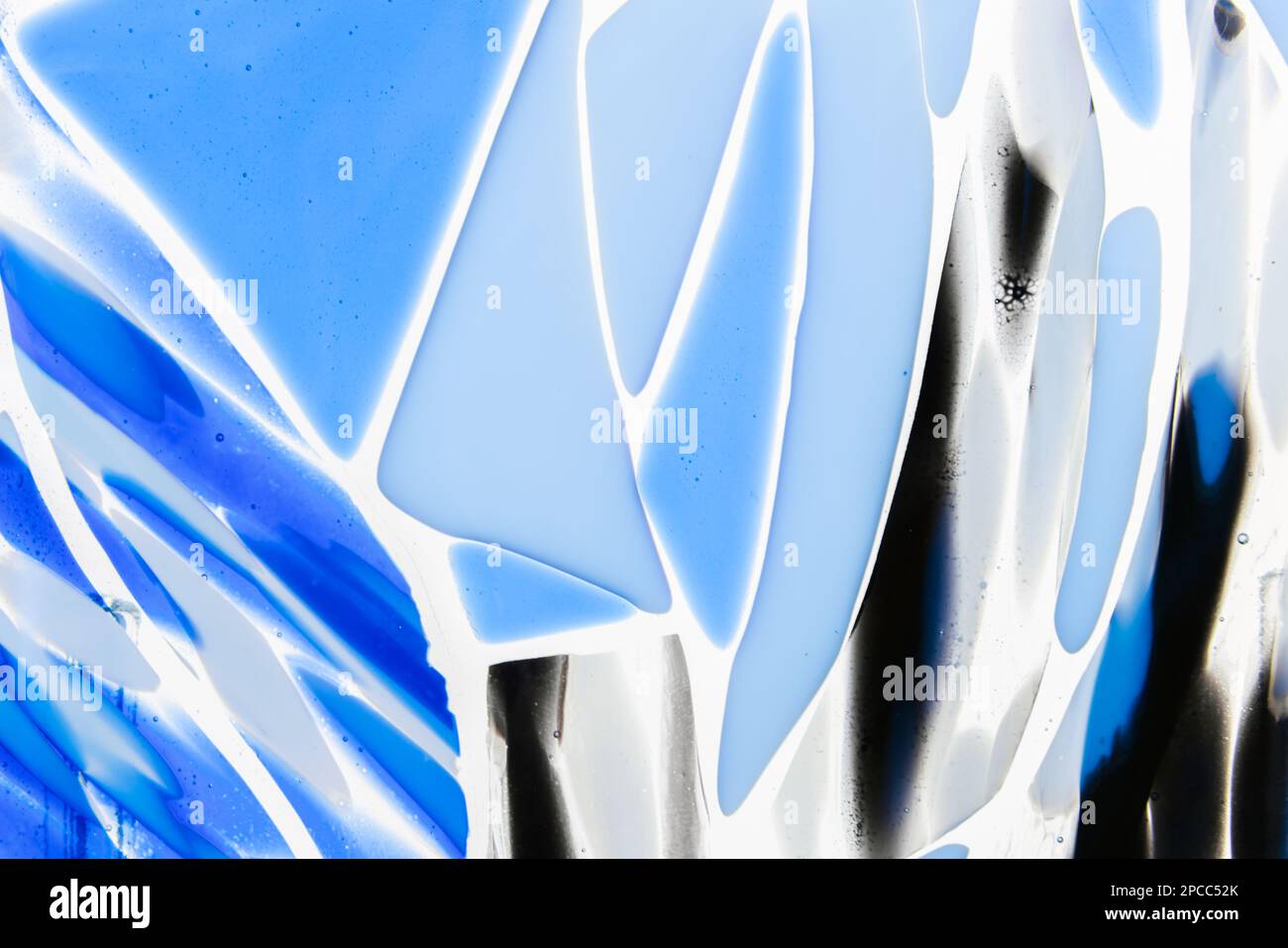 Blue white pattern of fused glass. Glass fusing is the joining together