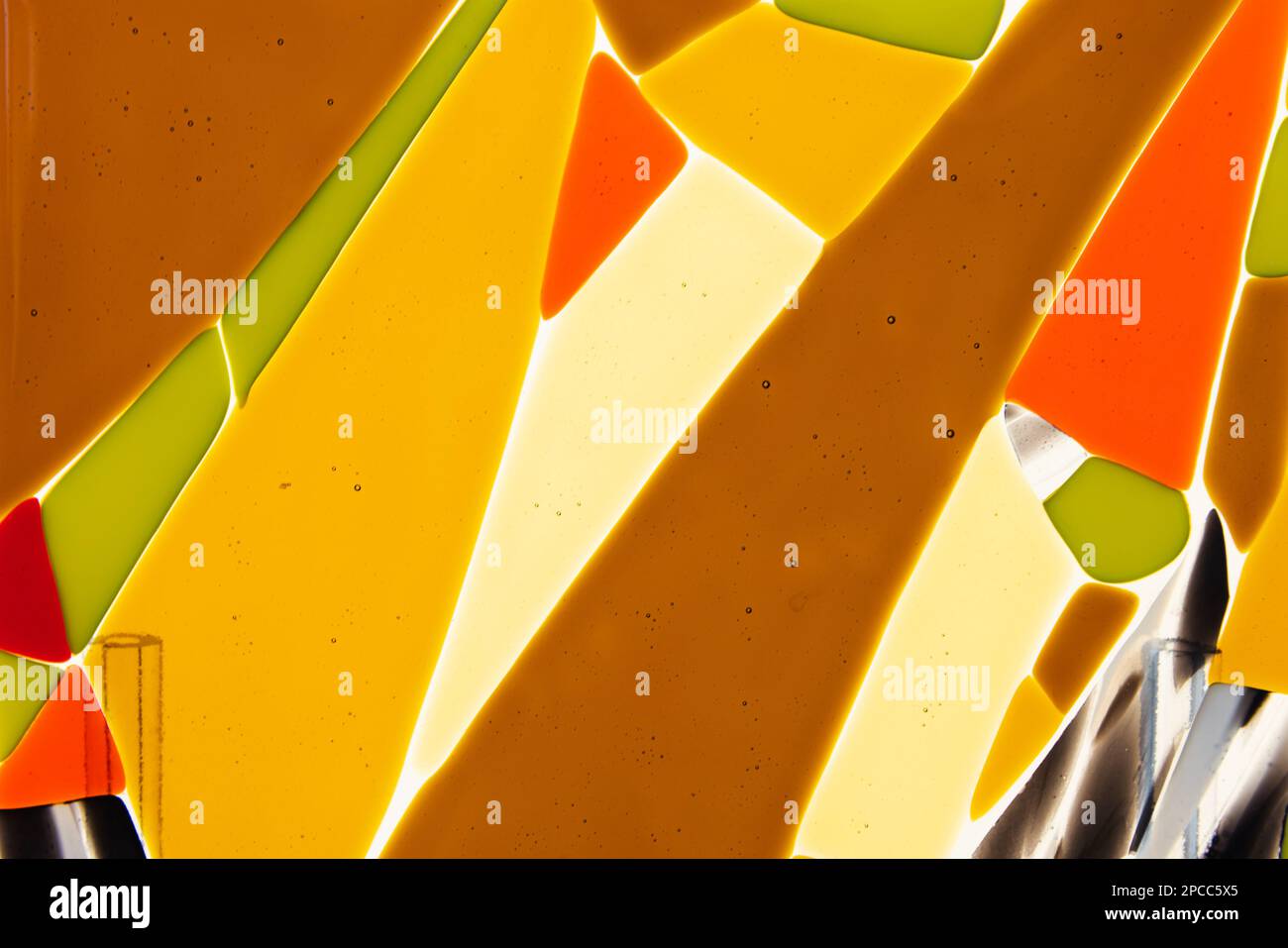 Abstract colorful geometric pattern of fused glass. Glass fusing is the