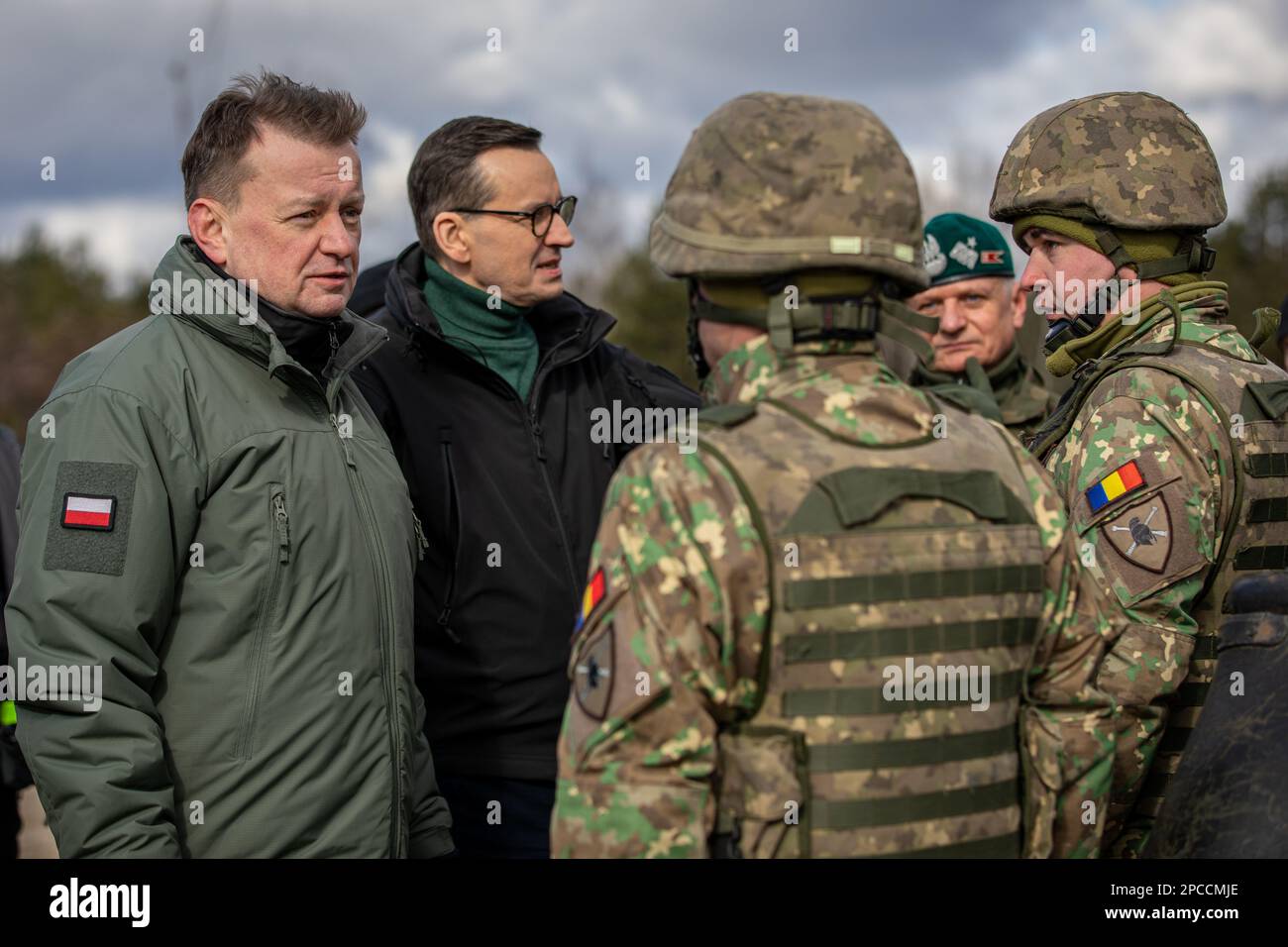 Warsaw, Poland. 12th Mar, 2023. Polish Defense, Mariusz Błaszczak, left, and Polish Prime Minister Mateusz Morawiecki, center and speak with Romanian soldiers assigned to the Sky Guardians, NATO eFP Battle Group Poland, during the Train with NATO event, March 12, 2023 in Warsaw, Poland. Credit: Sgt. Lianne Hirano/U.S Army/Alamy Live News Stock Photo