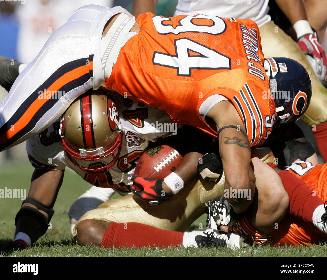 Chicago Bears linebacker Brendon Ayanbadejo (94) lifts off his helmet in  the fourth quarter of a football game against Dallas Cowboys Sunday, Sept.  23, 2007 in Chicago. (AP Photo/Nam Y. Huh Stock