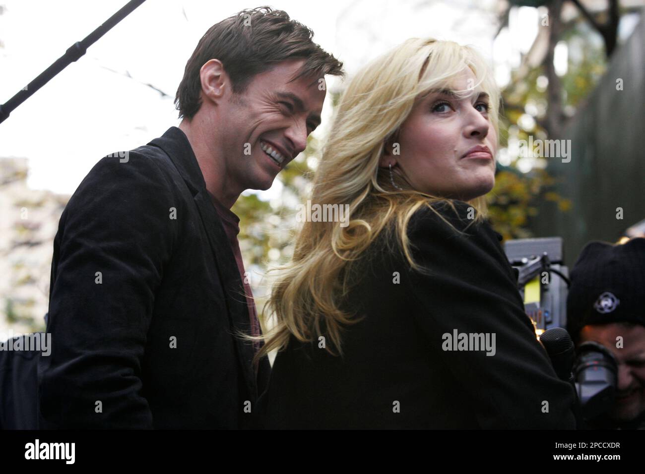 Actors Kate Winslet, right, and Hugh Jackman pose for photographers as ...