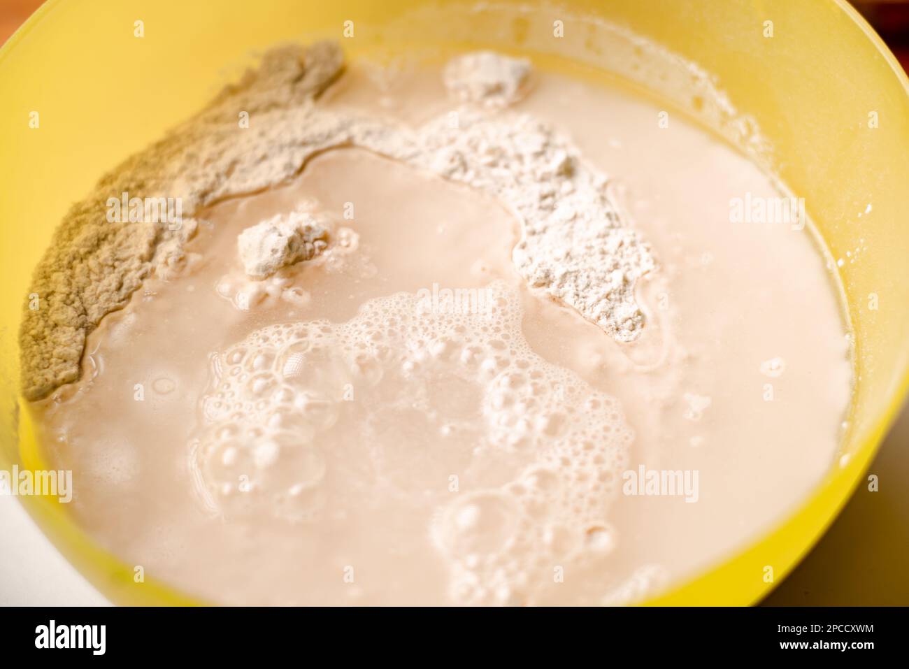 Mixing flour, dry yeast and water. Cooking dough for bread or pizza