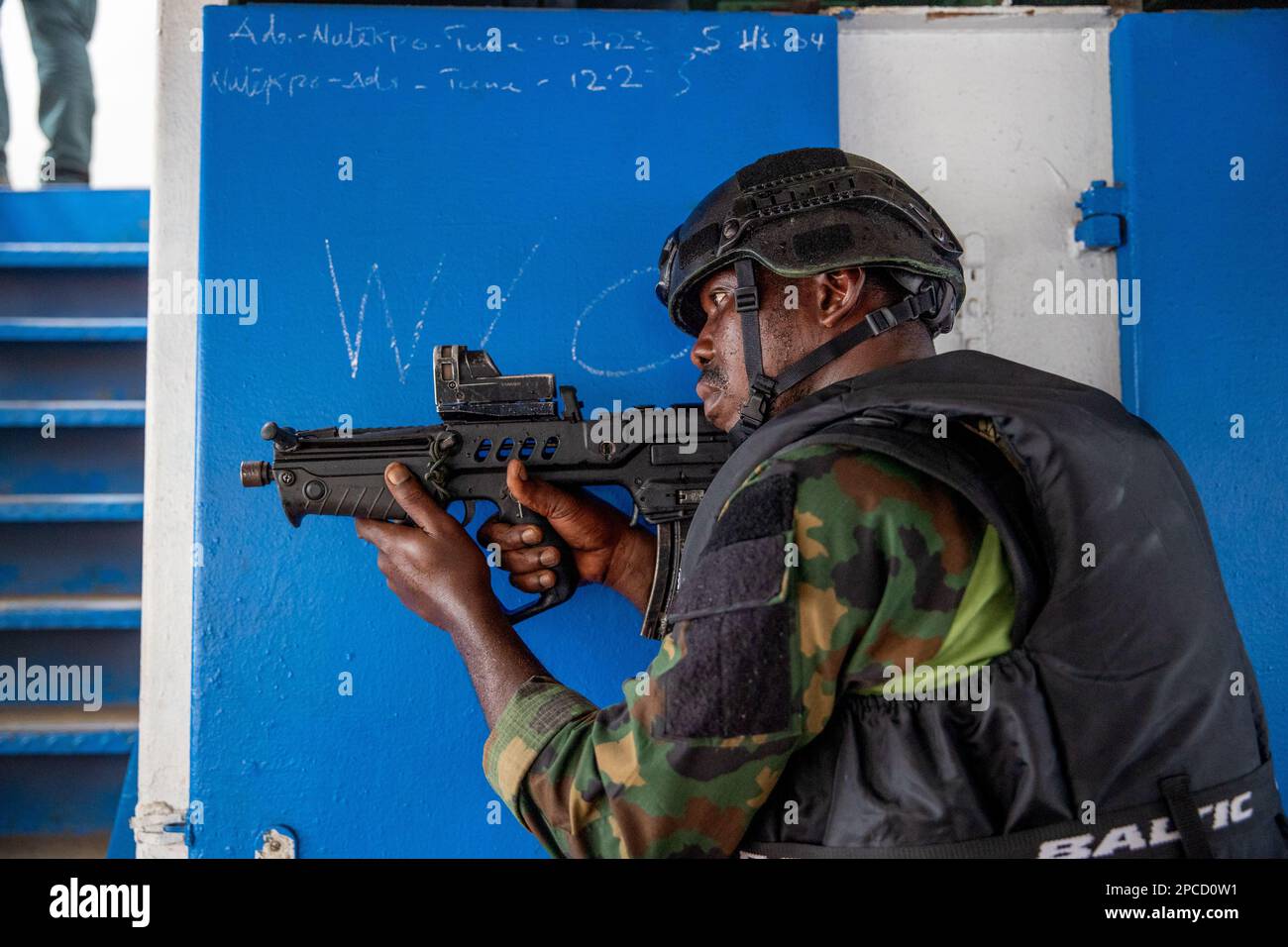 Volta, Ghana. 11th Mar, 2023. A member of the Nigeria Armed Forces begins clearing operations during a hostage rescue tactical training display onboard a ship during the annual Flintlock multi-national exercise, March 11, 2023 in Volta, Ghana. Credit: SSgt. Charles Brock/US Army Photo/Alamy Live News Stock Photo