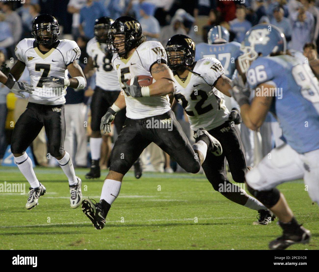 Wake Forest's Jon Abbate (5) runs with the ball after he intercepted a