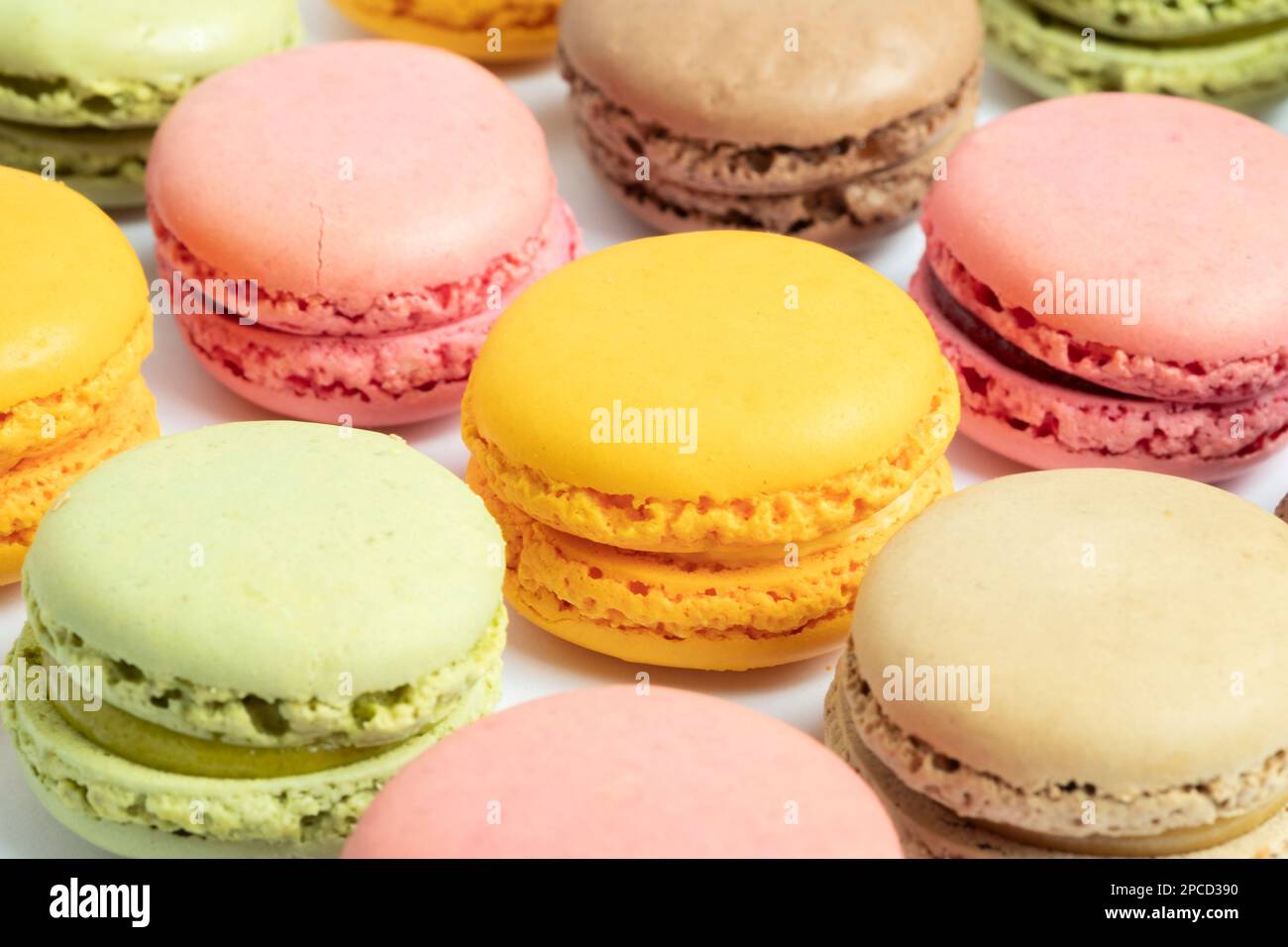 Multi-coloured Macarons on white background Stock Photo